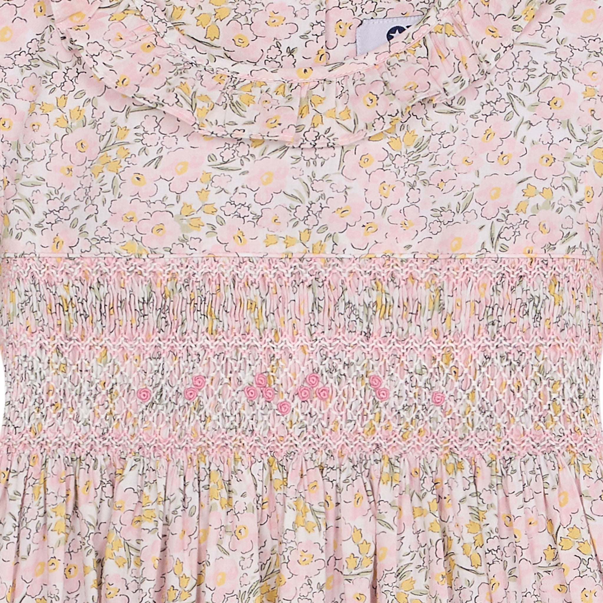 Floral fabric with a hand-smocking and embroidery