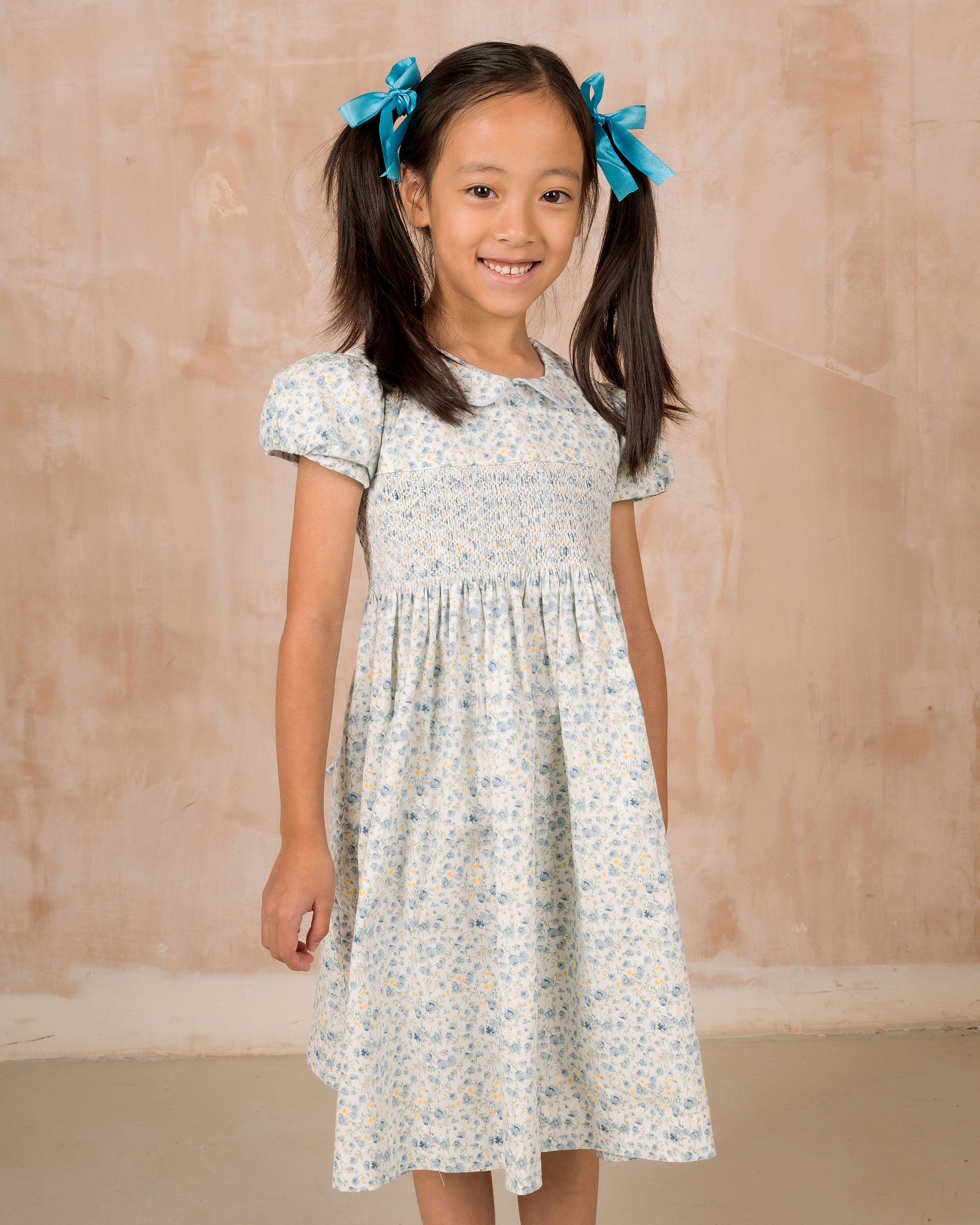 girl in smocked floral dress