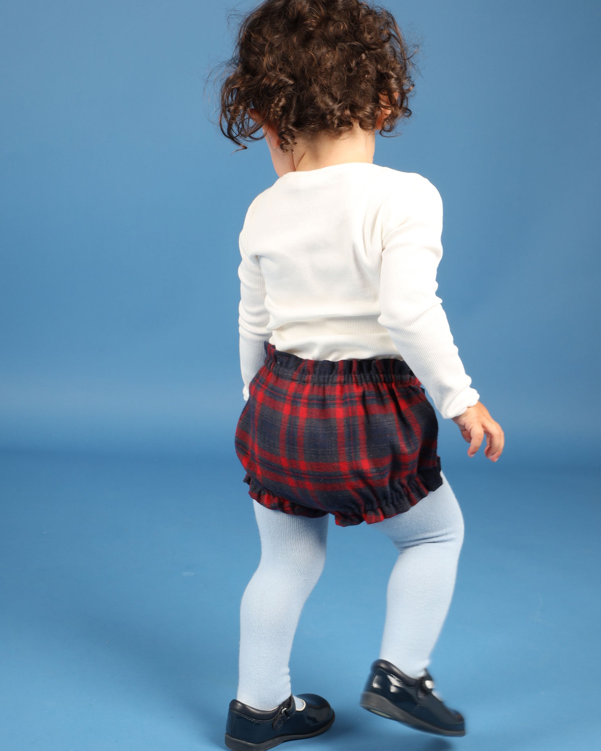 baby in Tartan shorts with bow, back