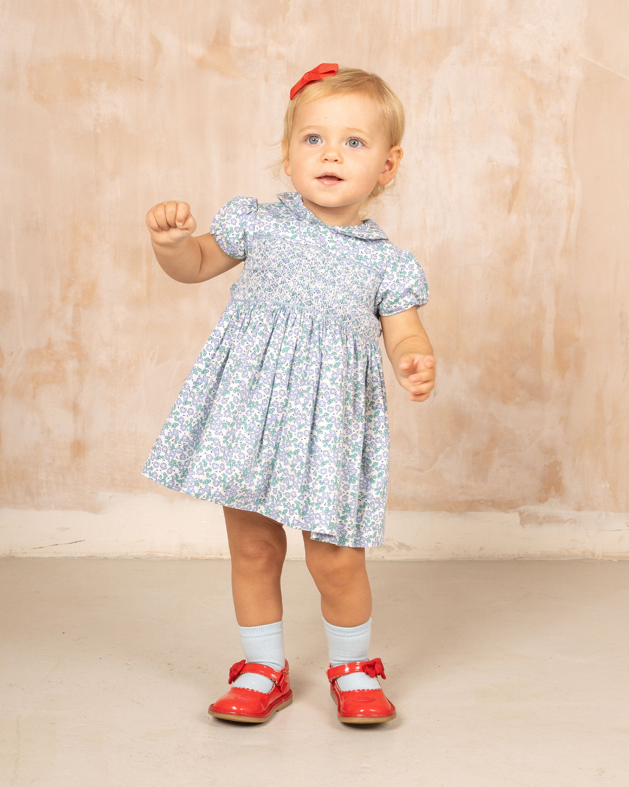 baby in lilac floral dress, smocked