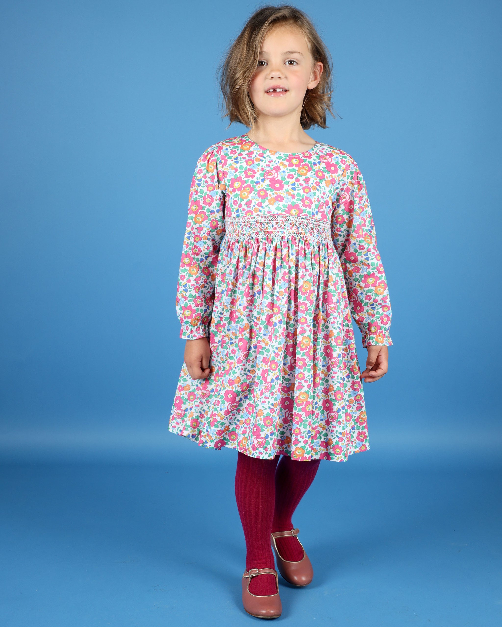 girl in floral dress made from Liberty fabric