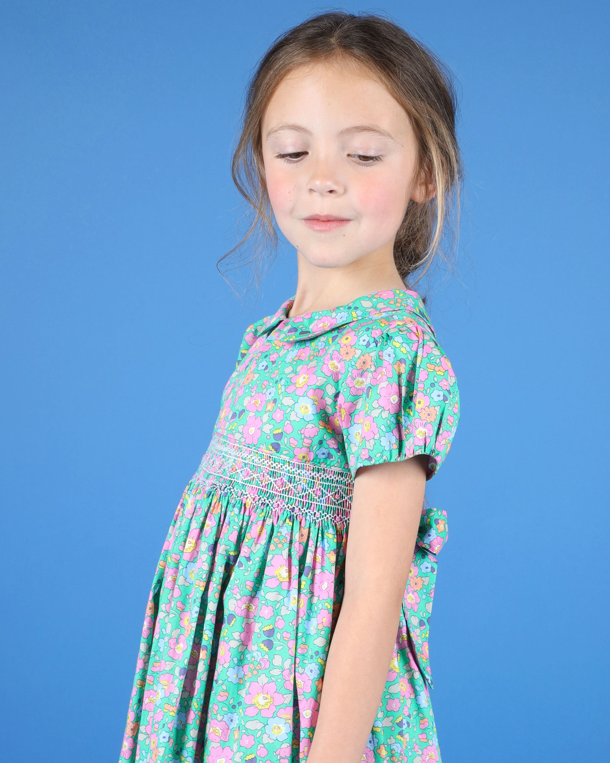 girls wearing green floral dress for girls, made from Liberty fabric, hand-smocked
