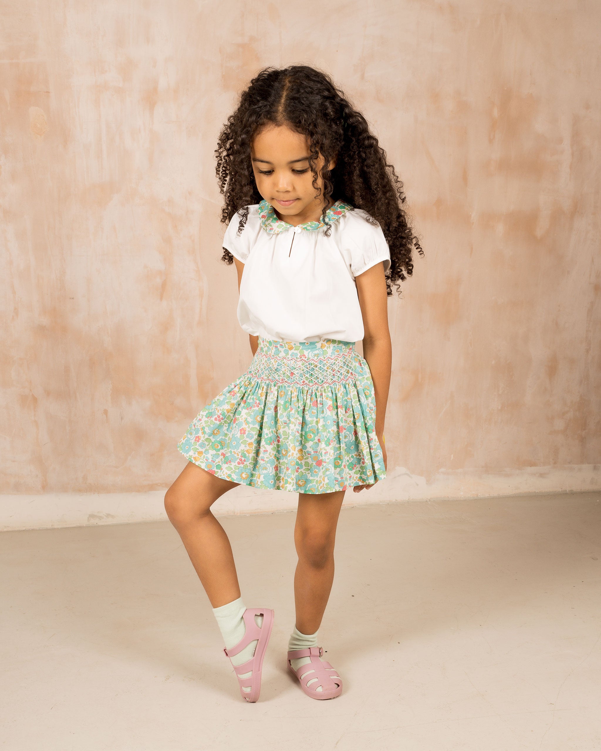 girl in Liberty fabric smock skirt