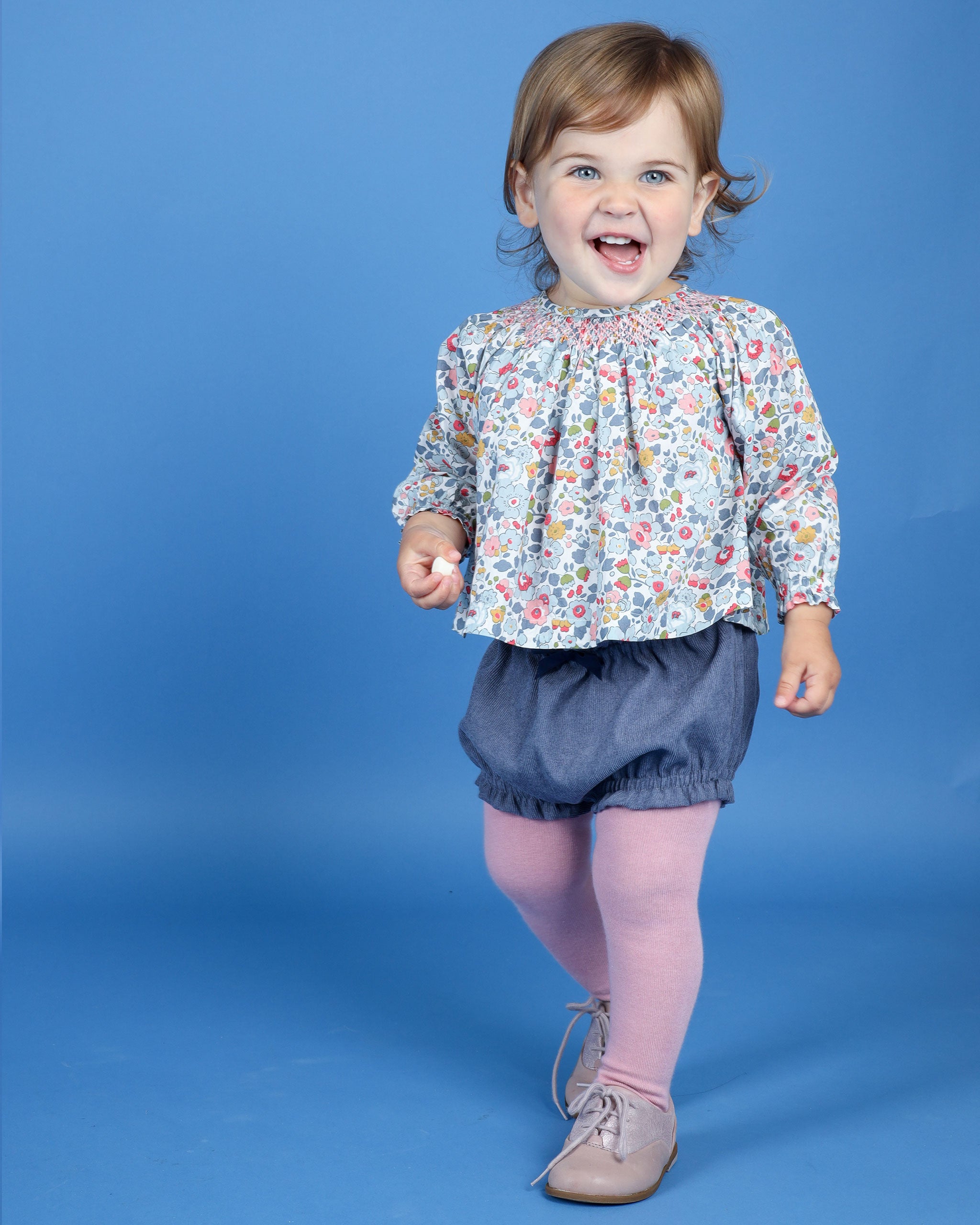 Baby in hand smocked Liberty blouse