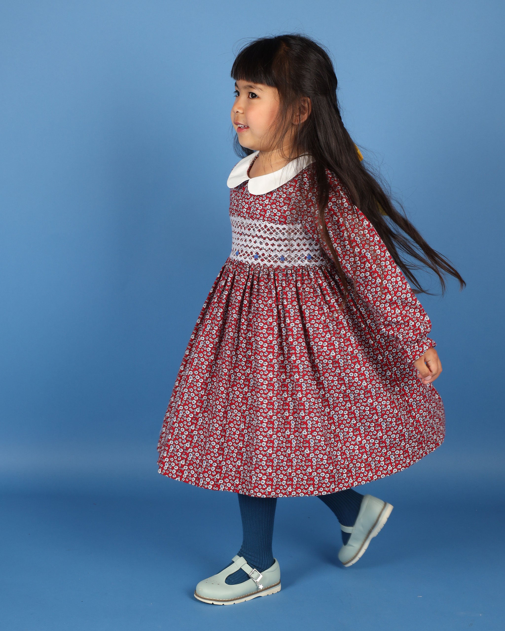 girl twirling in smocked dress