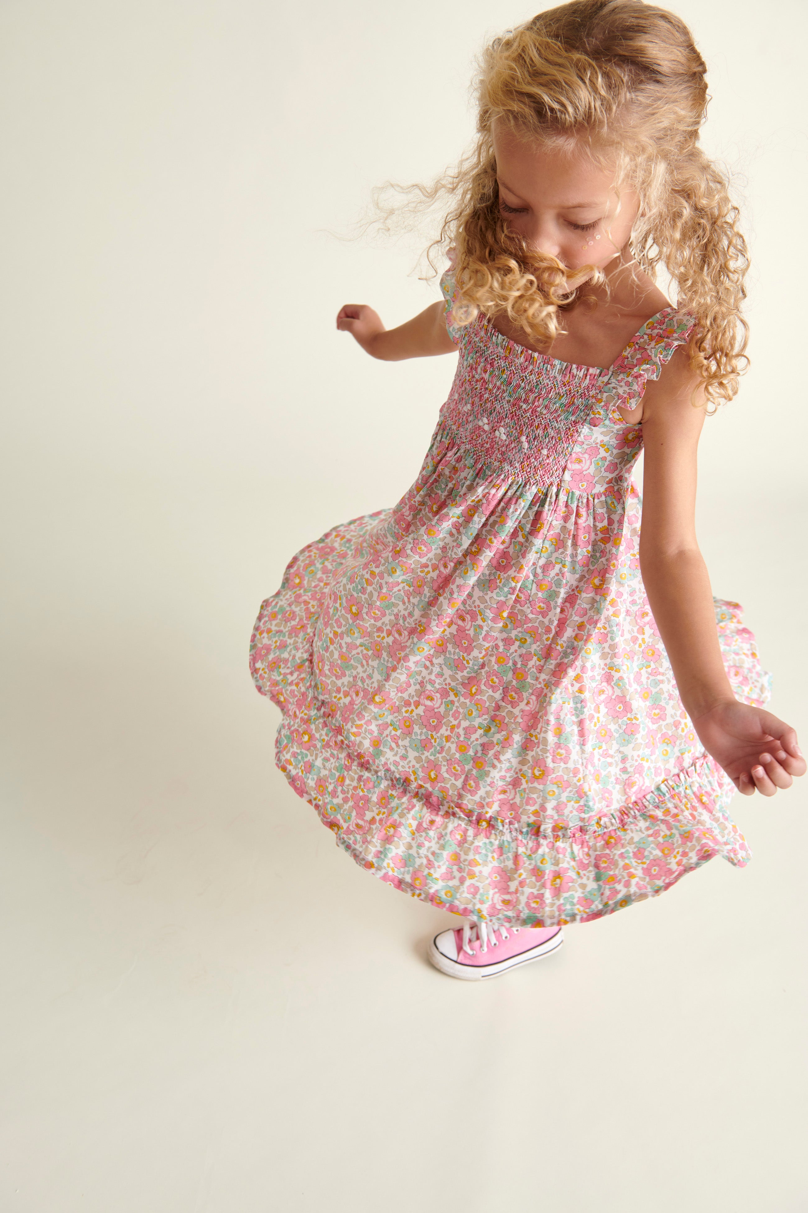 girls twirling in sun dress