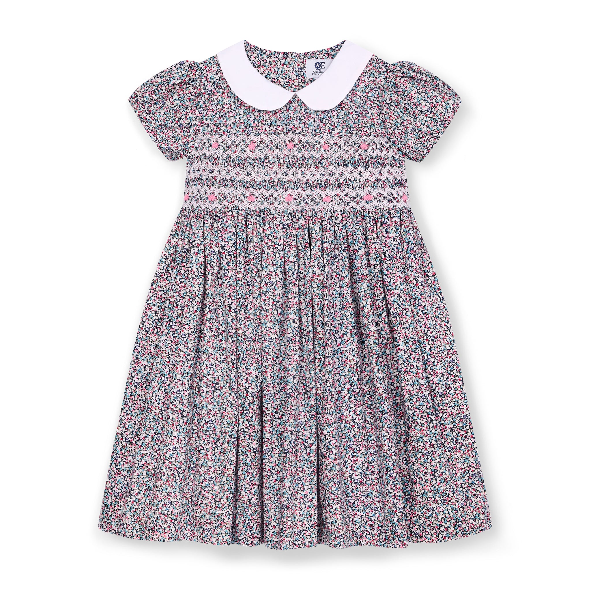 front of floral dress with a white collar and hand-mocking