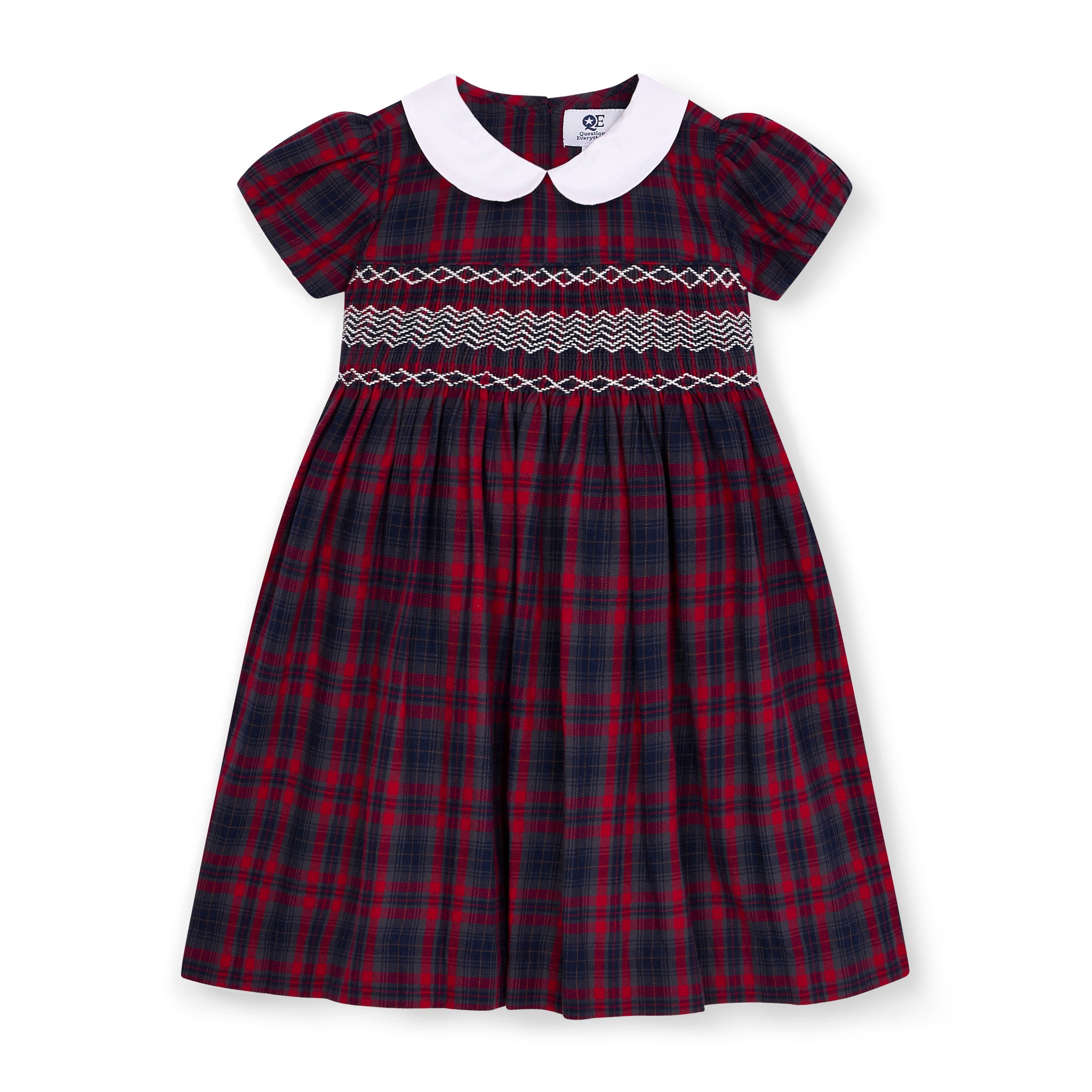 Hand-Smocked plaid dress with white collar on a white background