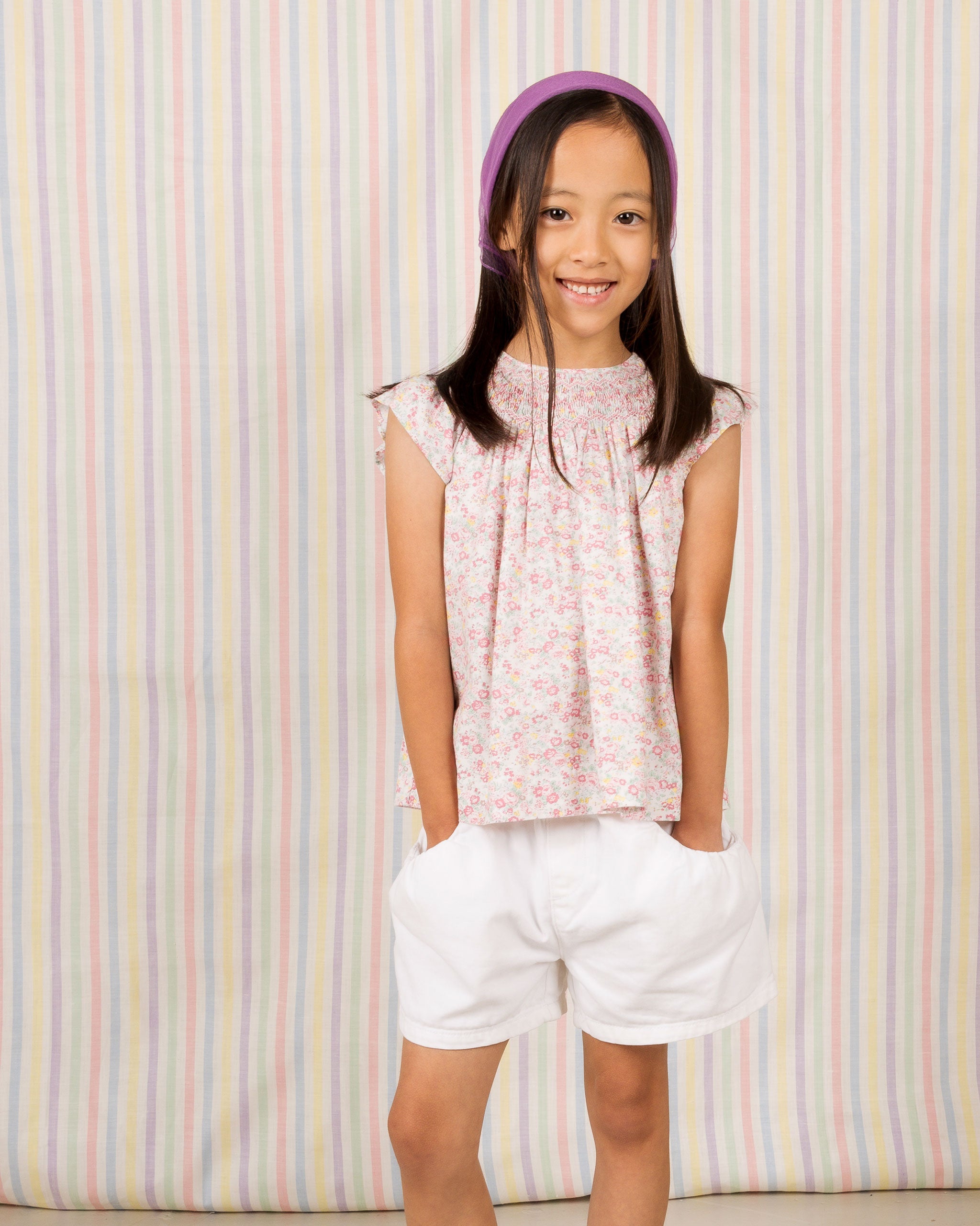 girl in smocked blouse, cap sleeves, floral