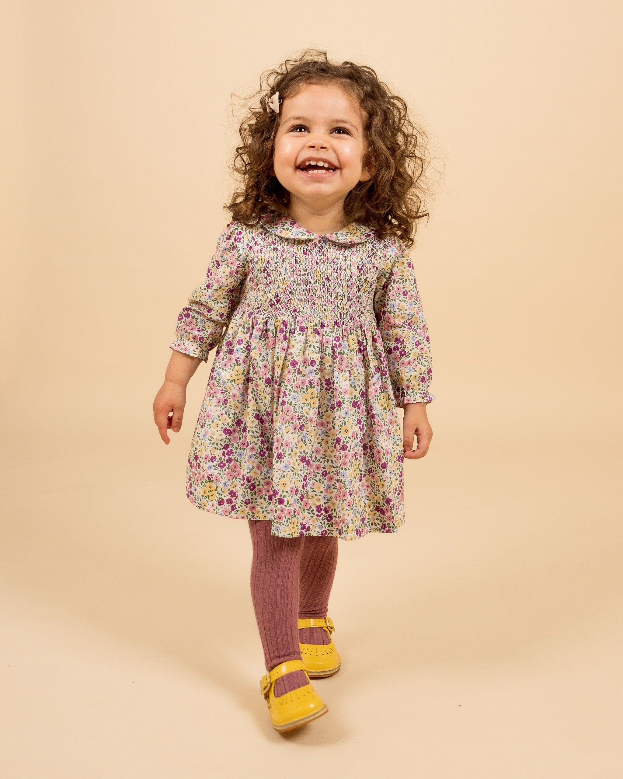 toddler in hand-smocked floral dress