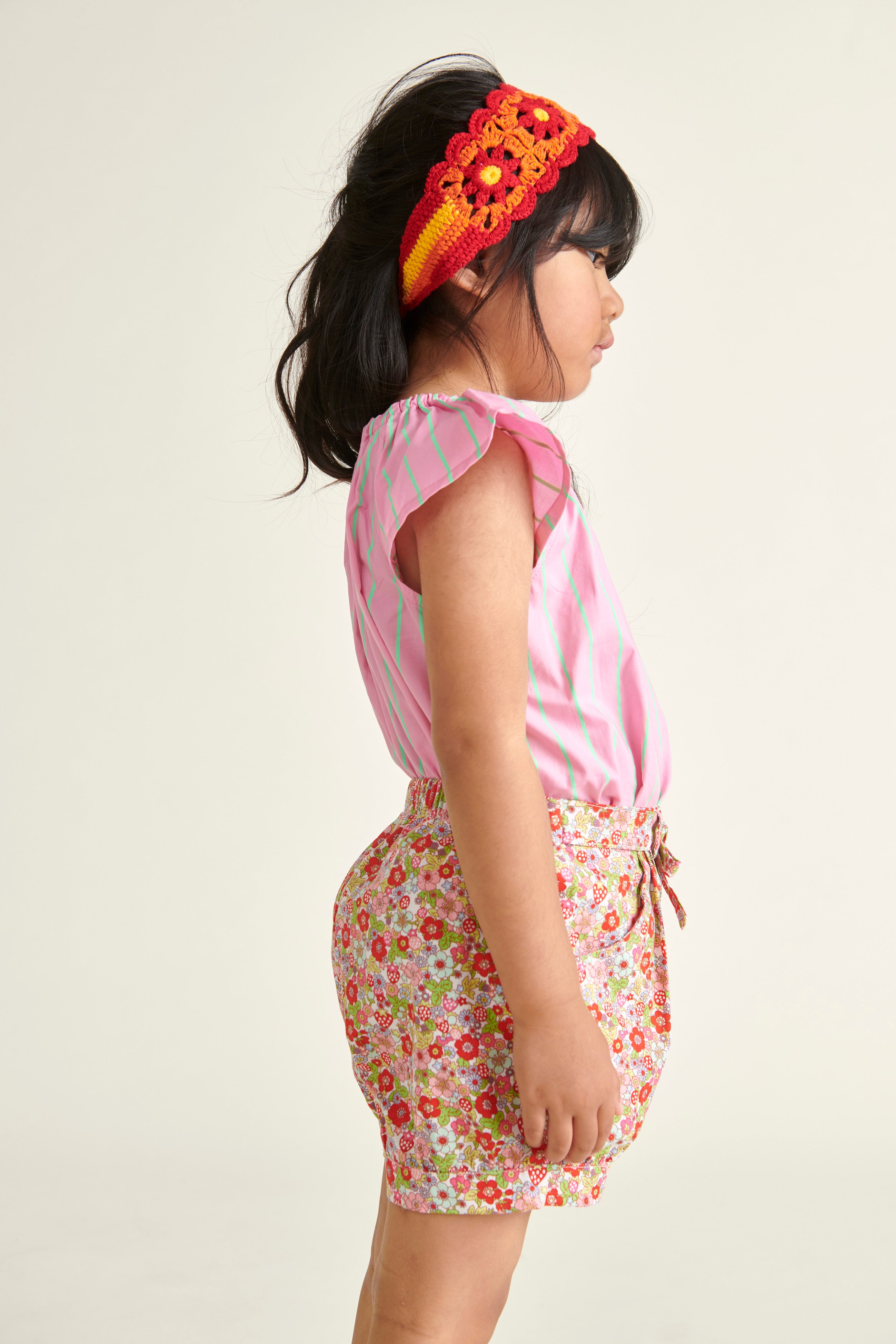 girl in short and blouse outfit