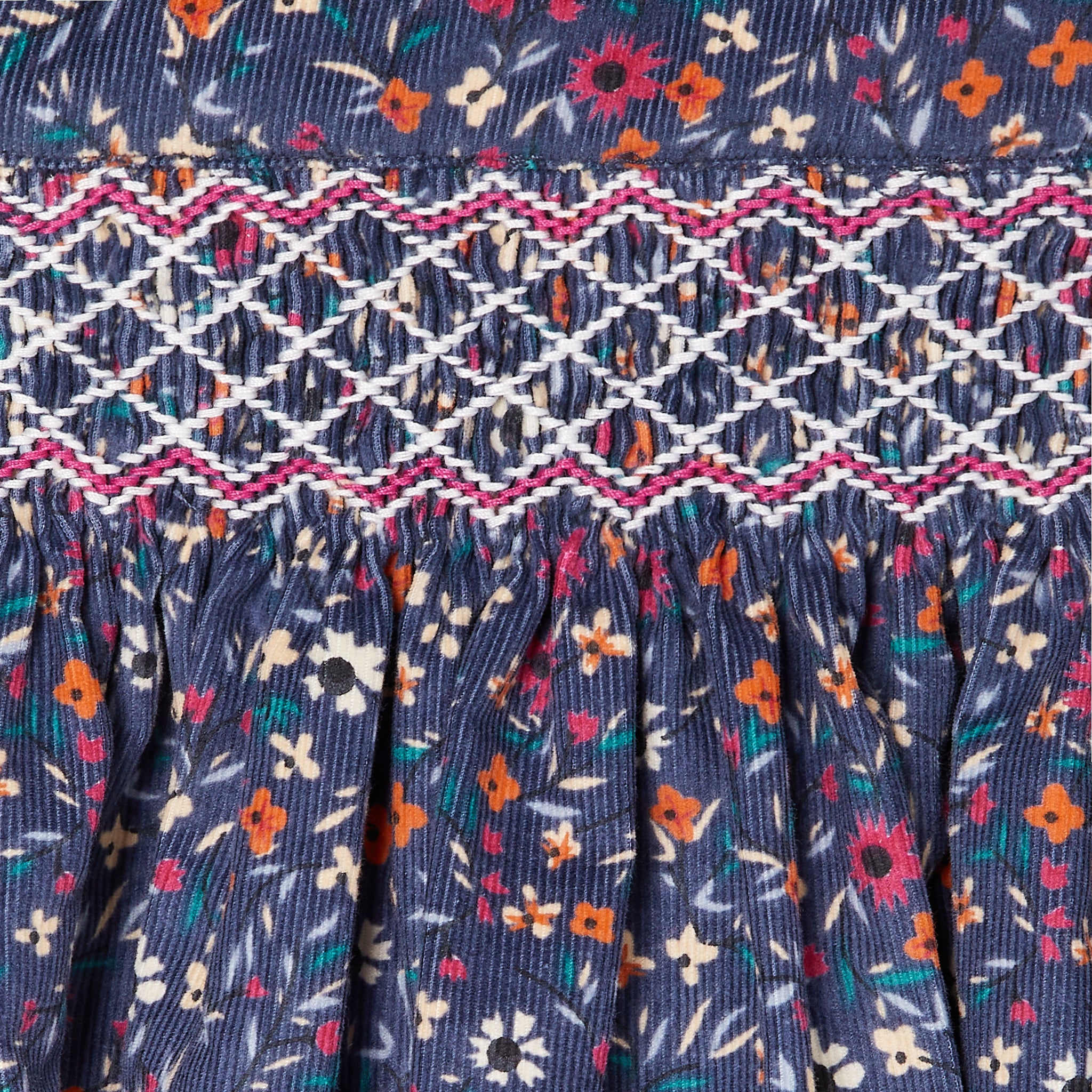 hand-smocked corduroy skirt, floral, detail shot