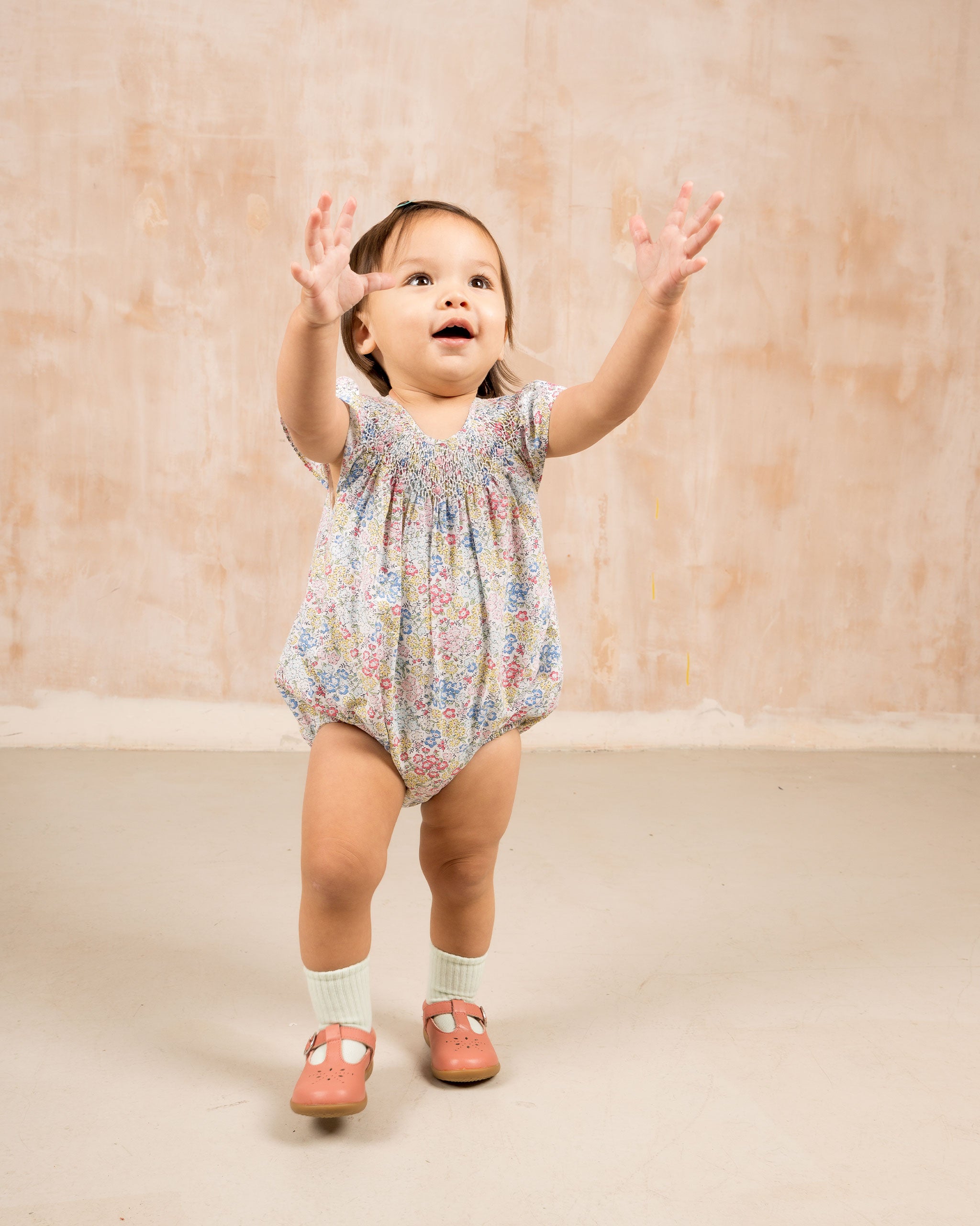 Toddler wearing floral baby bubble