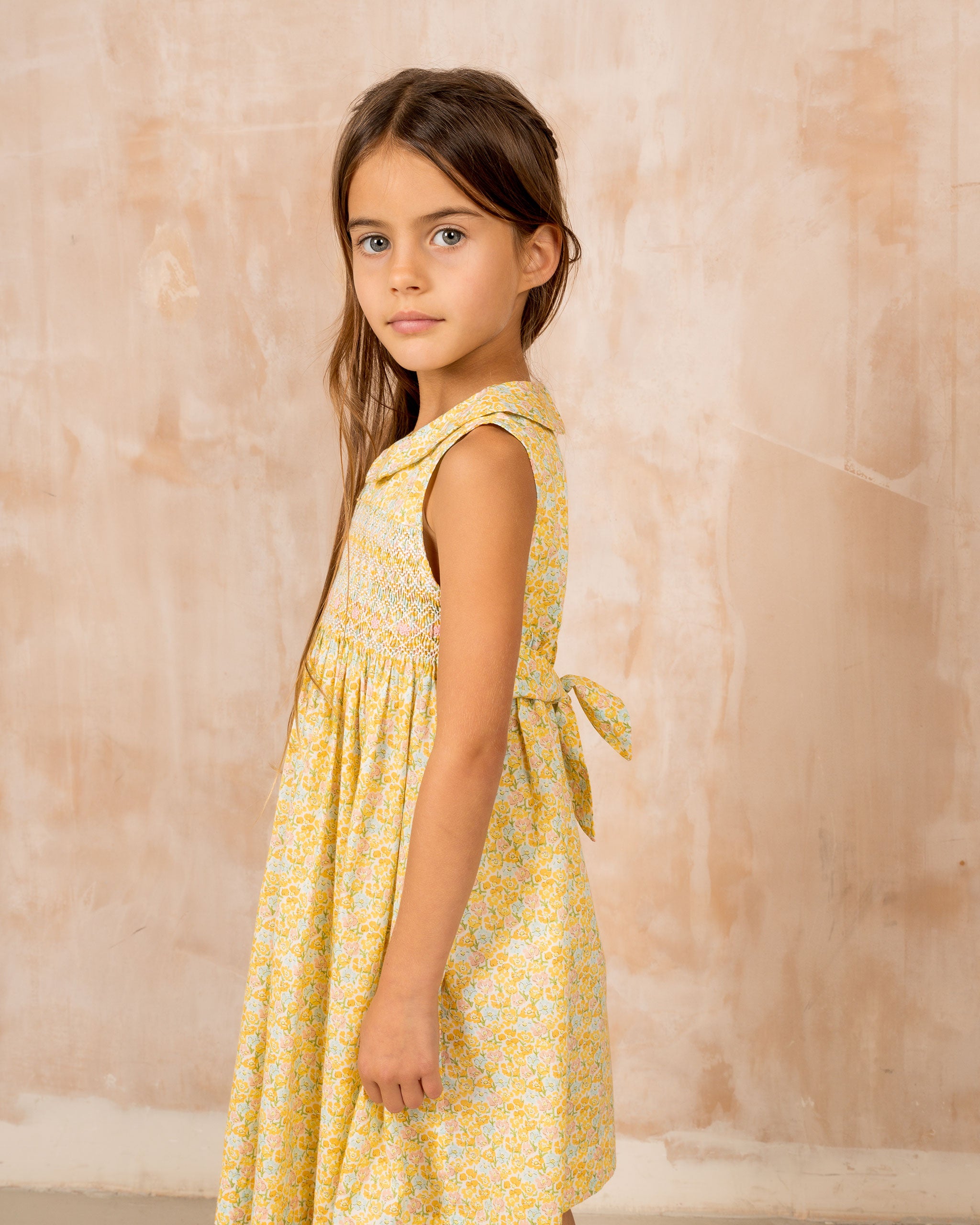 girl model wearing yellow, hand-smocked dress, easter outfit