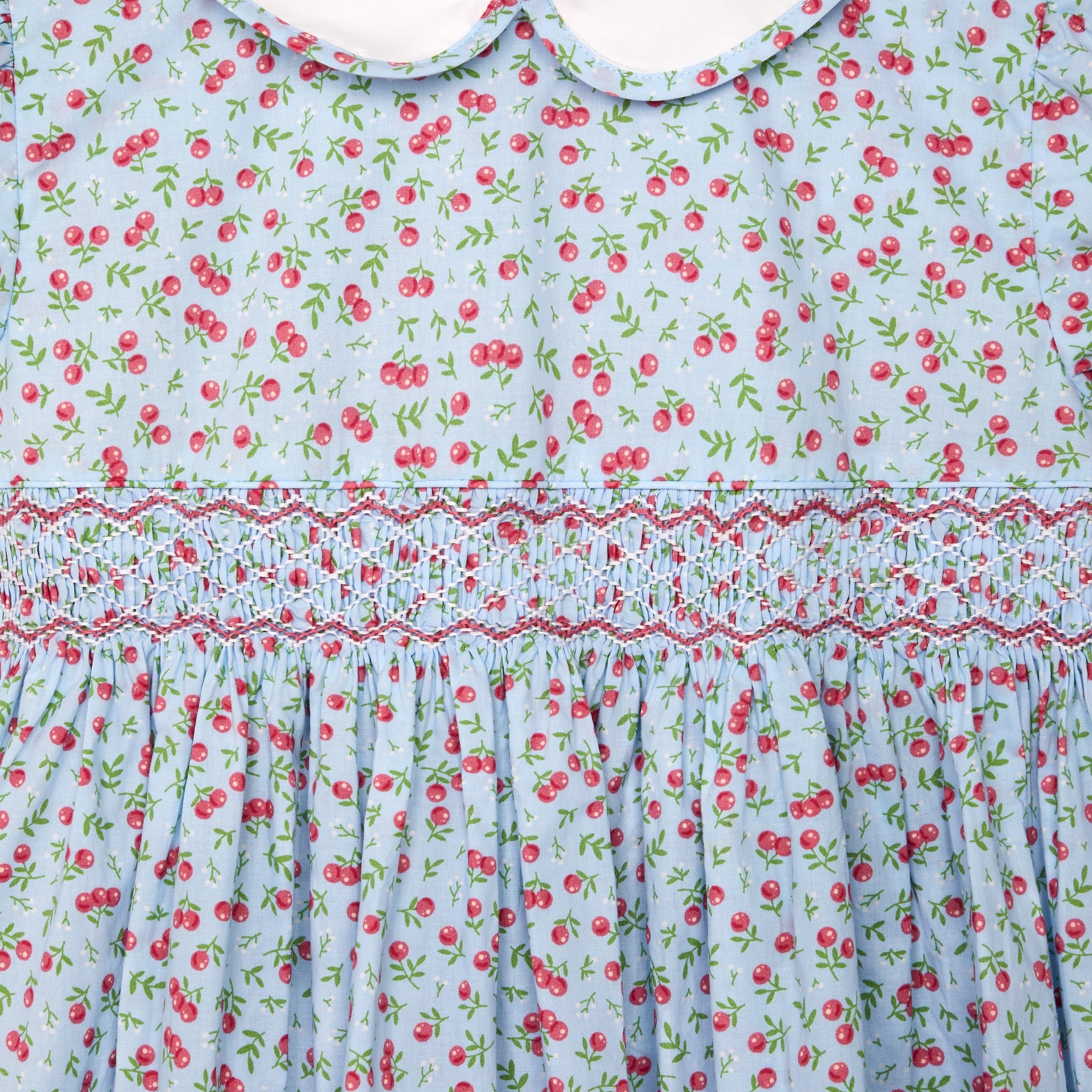cherry print girls dress, smocking closeup