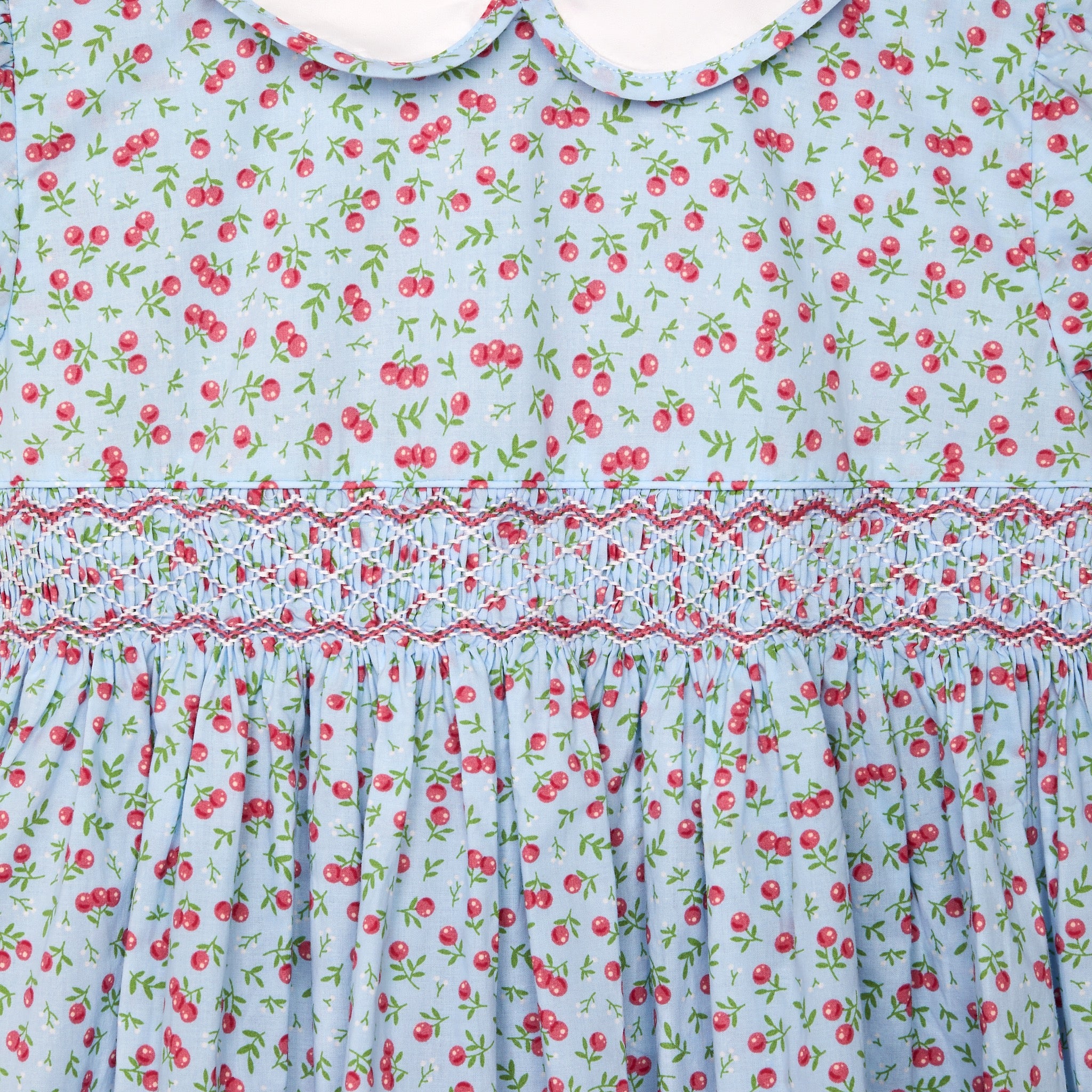 cherry print girls dress, smocking closeup