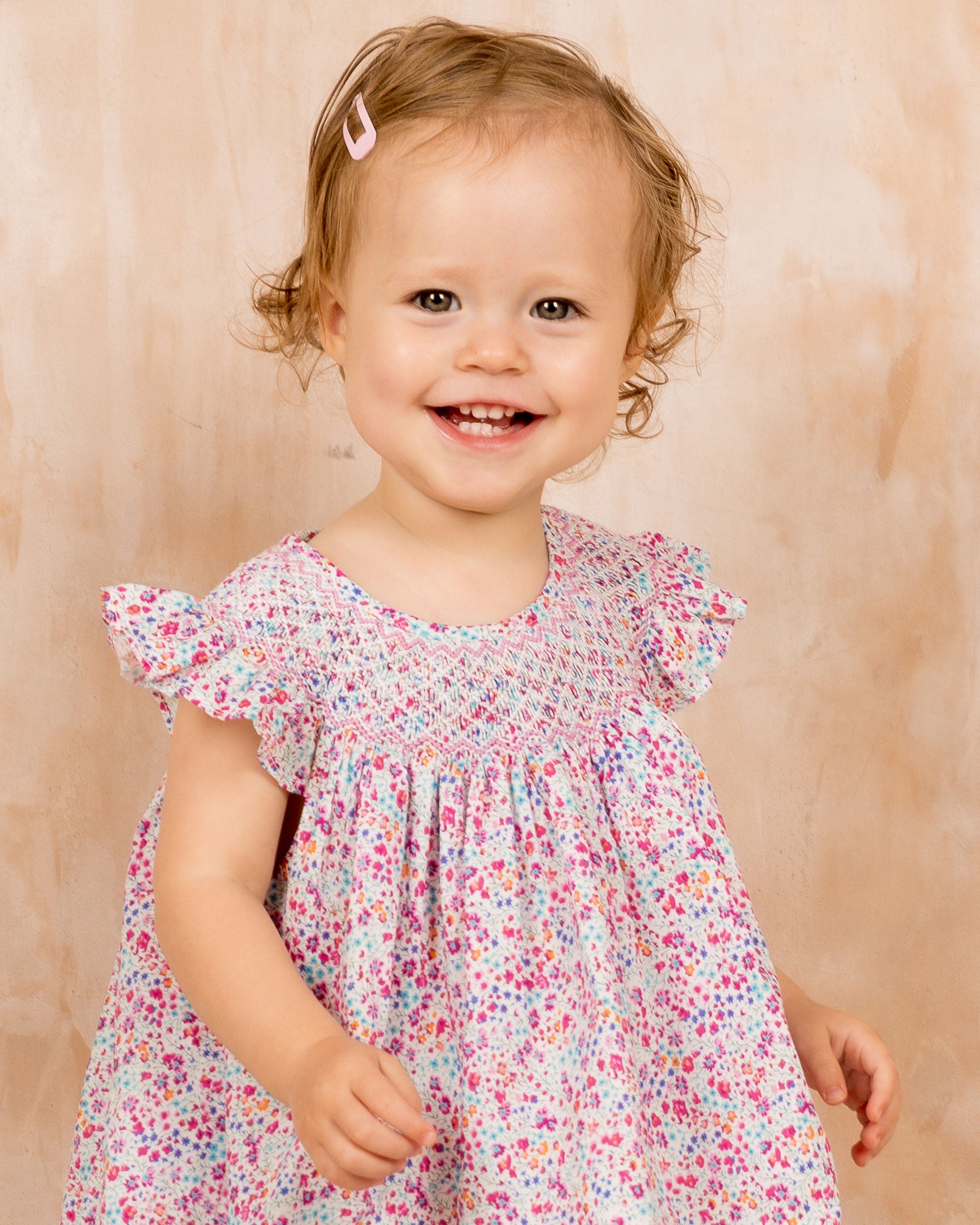 toddler girl in smocked dress