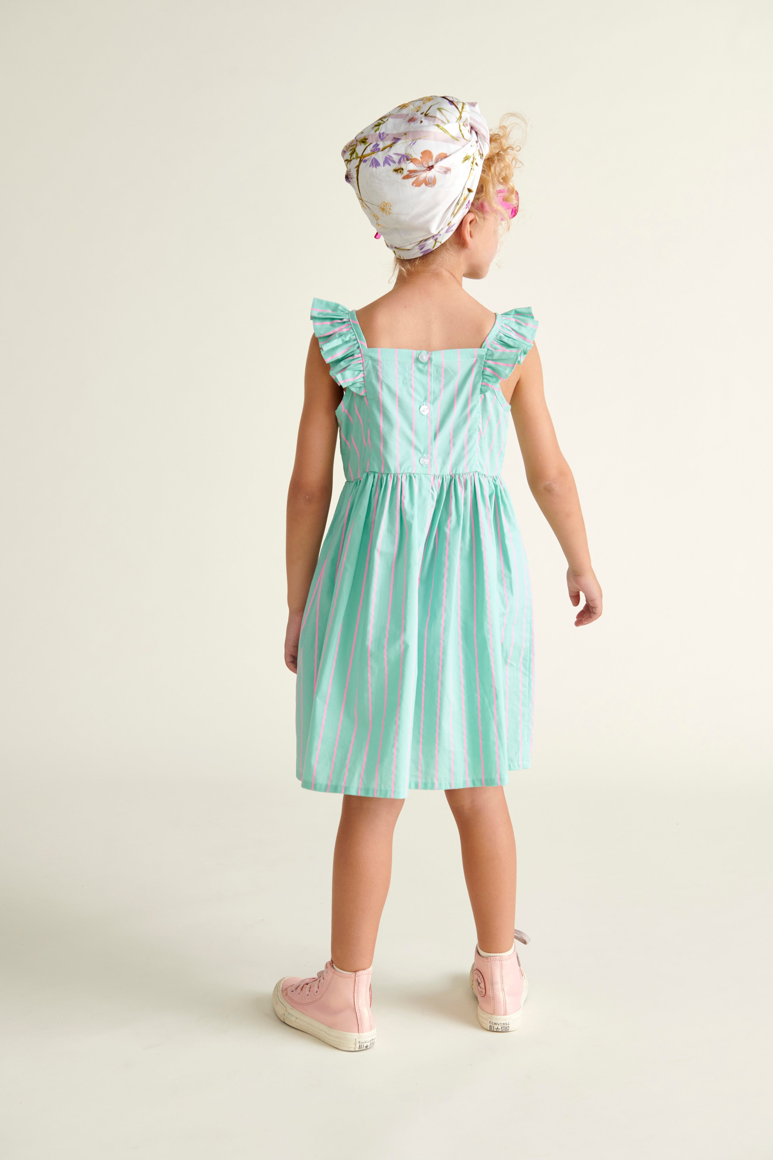 girl in mint green dress, back view