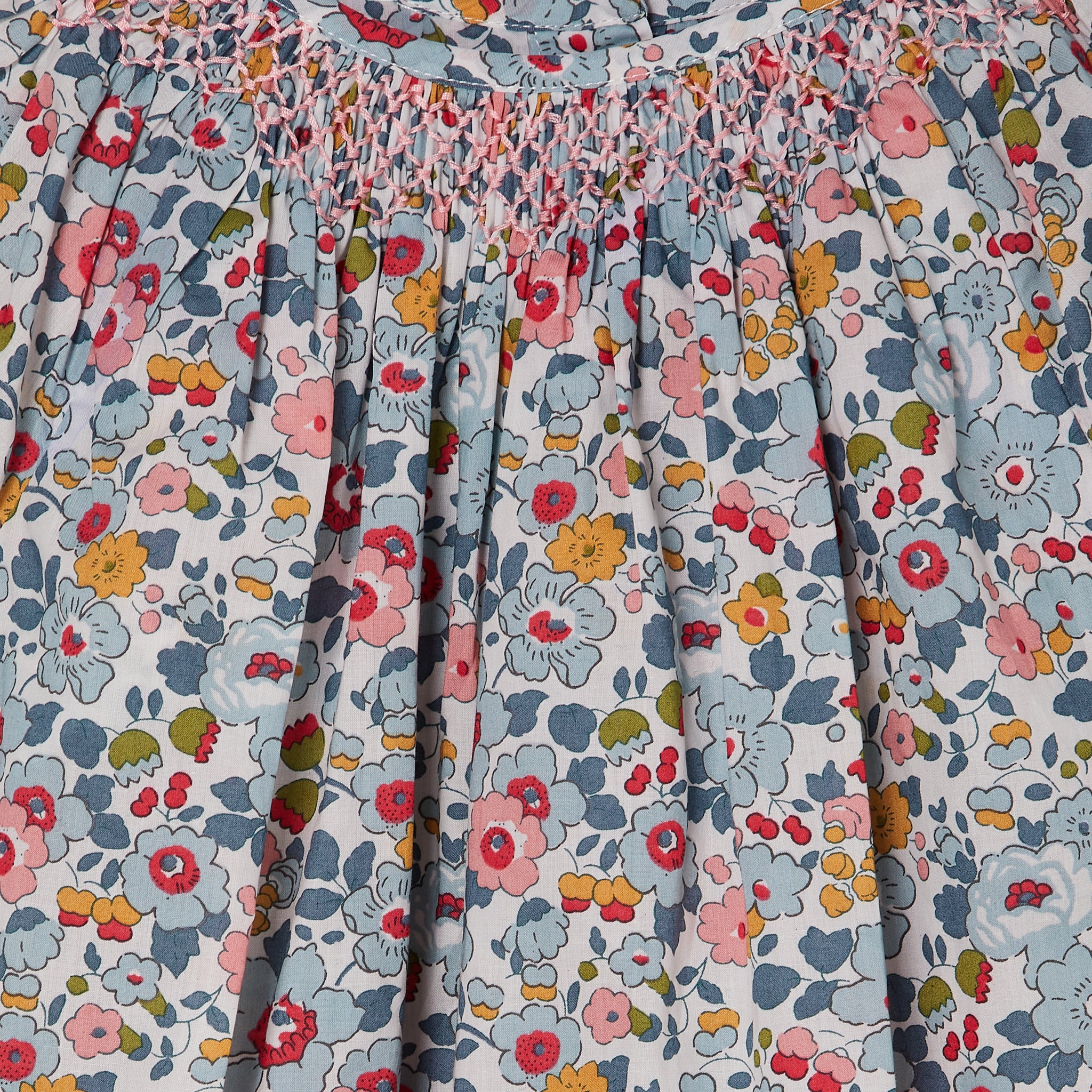 hand-smocked blouse made from Liberty Betsy fabric