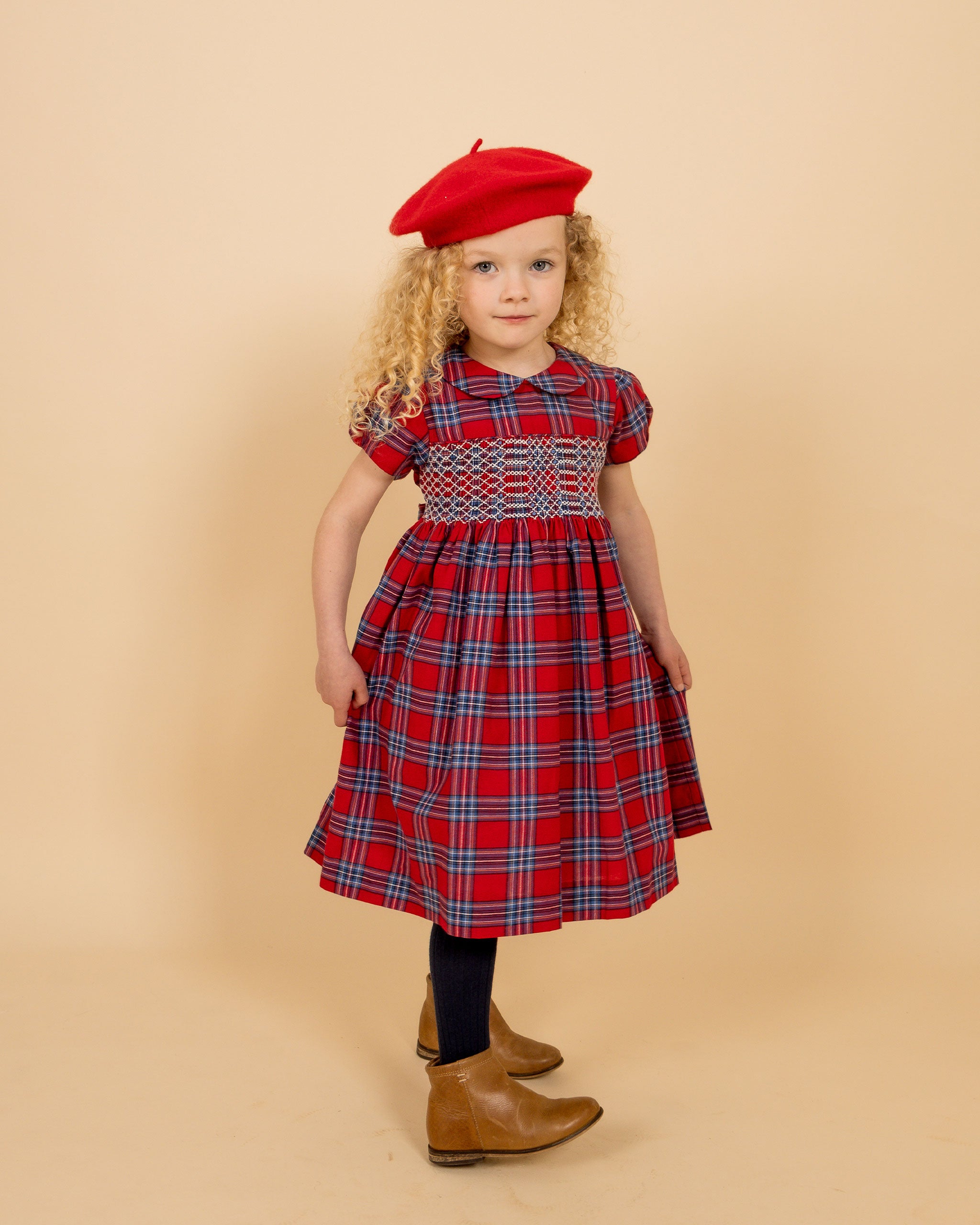 girl in red tartan dress