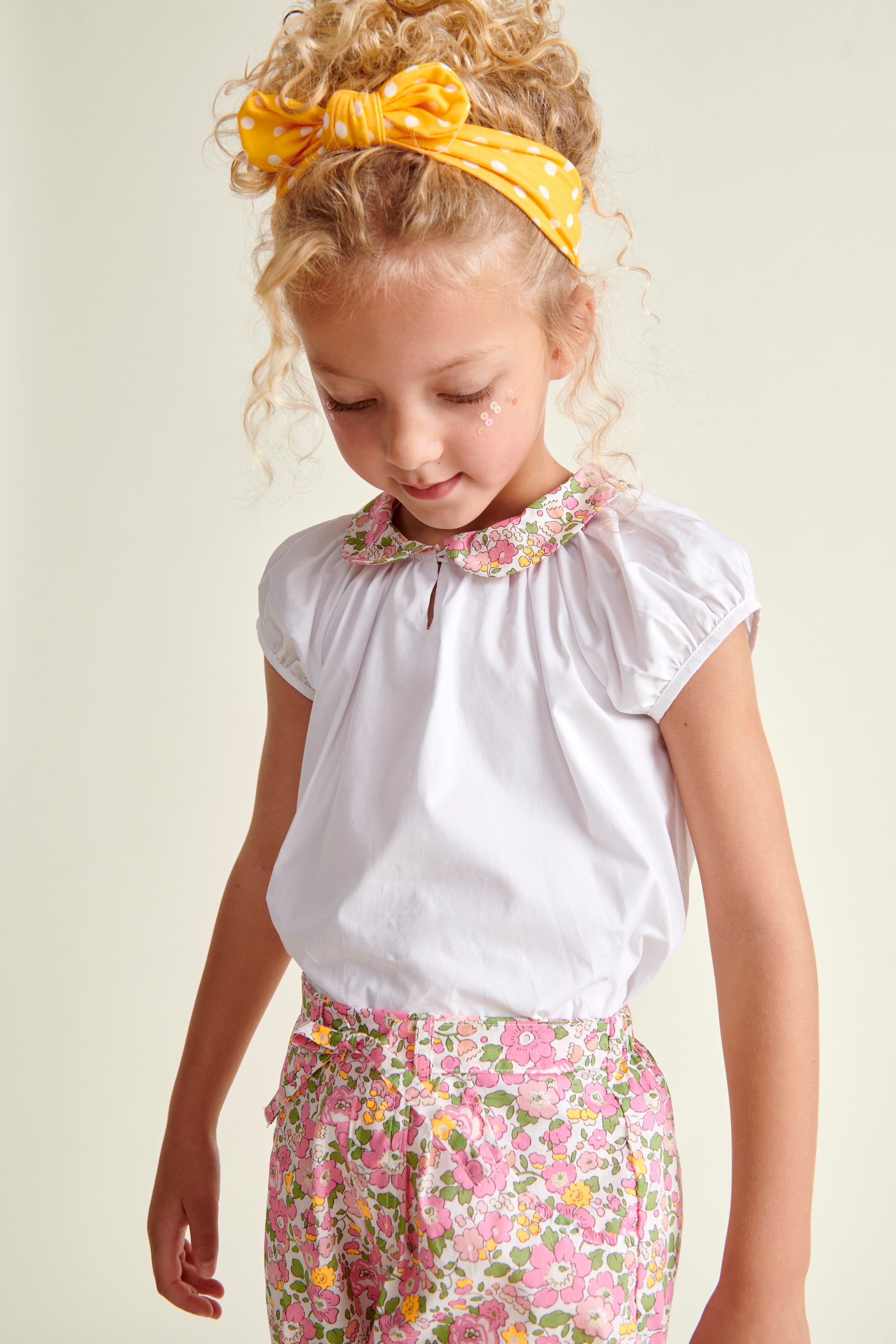 girl in blouse and short outfit