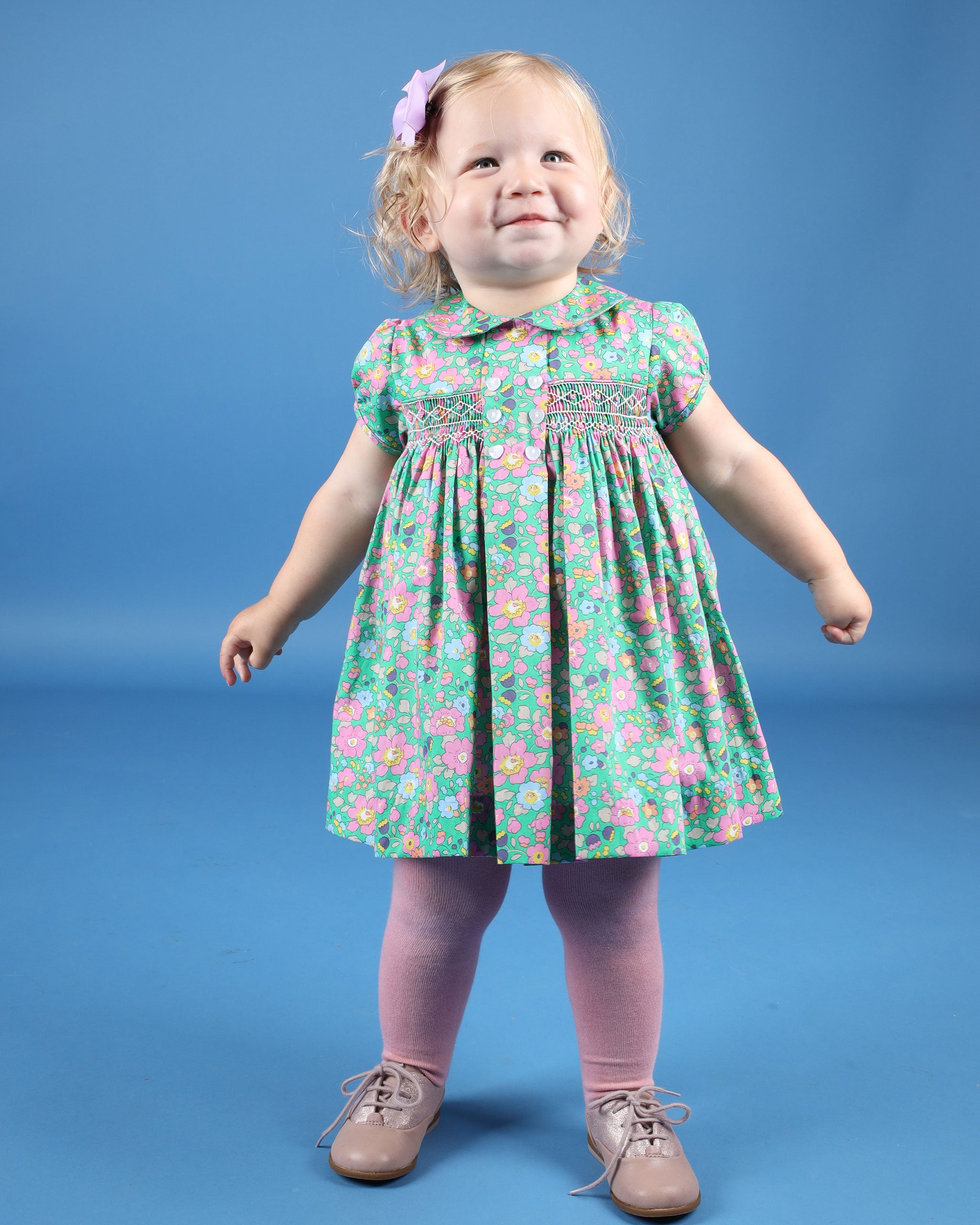 toddler in Liberty fabric dress, green, floral, hand-smocked