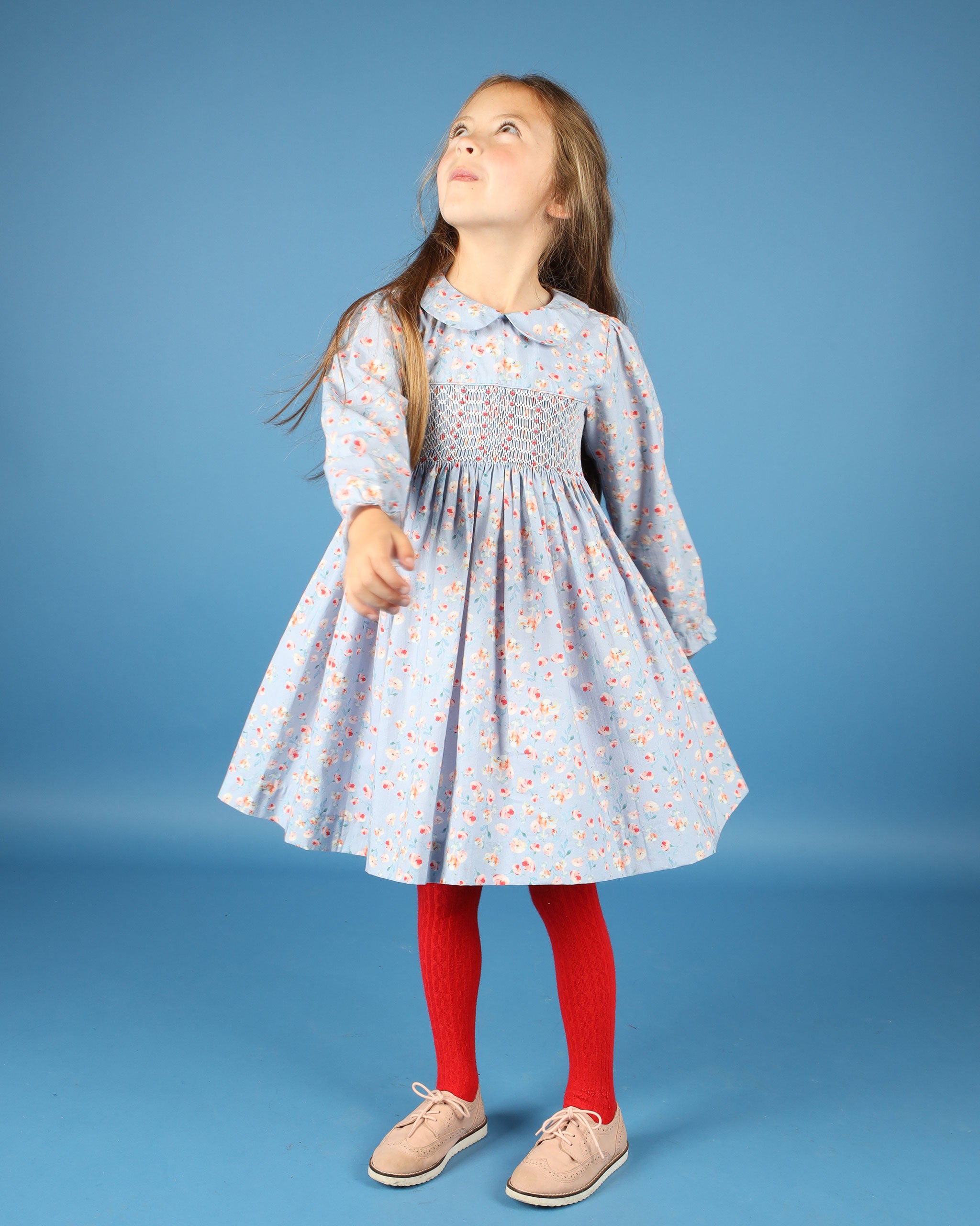 girl twirling in blue dress