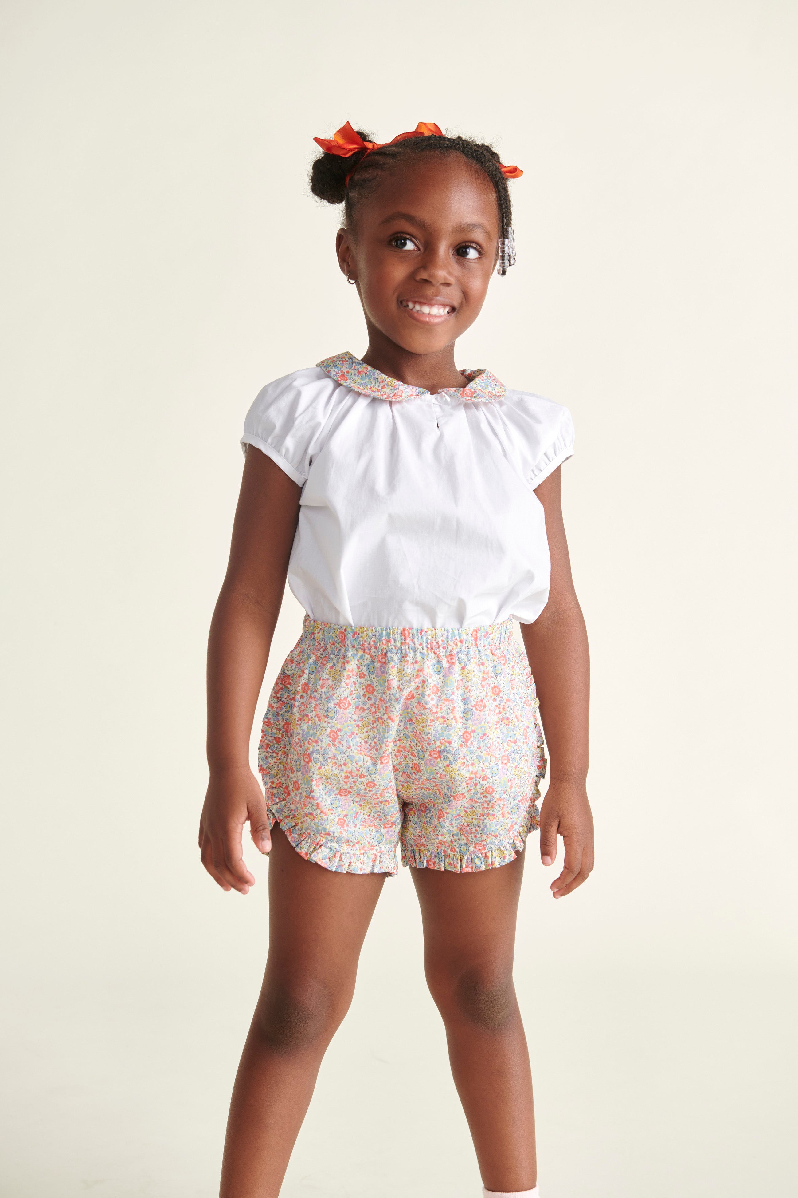 girl in matching blouse and shorts