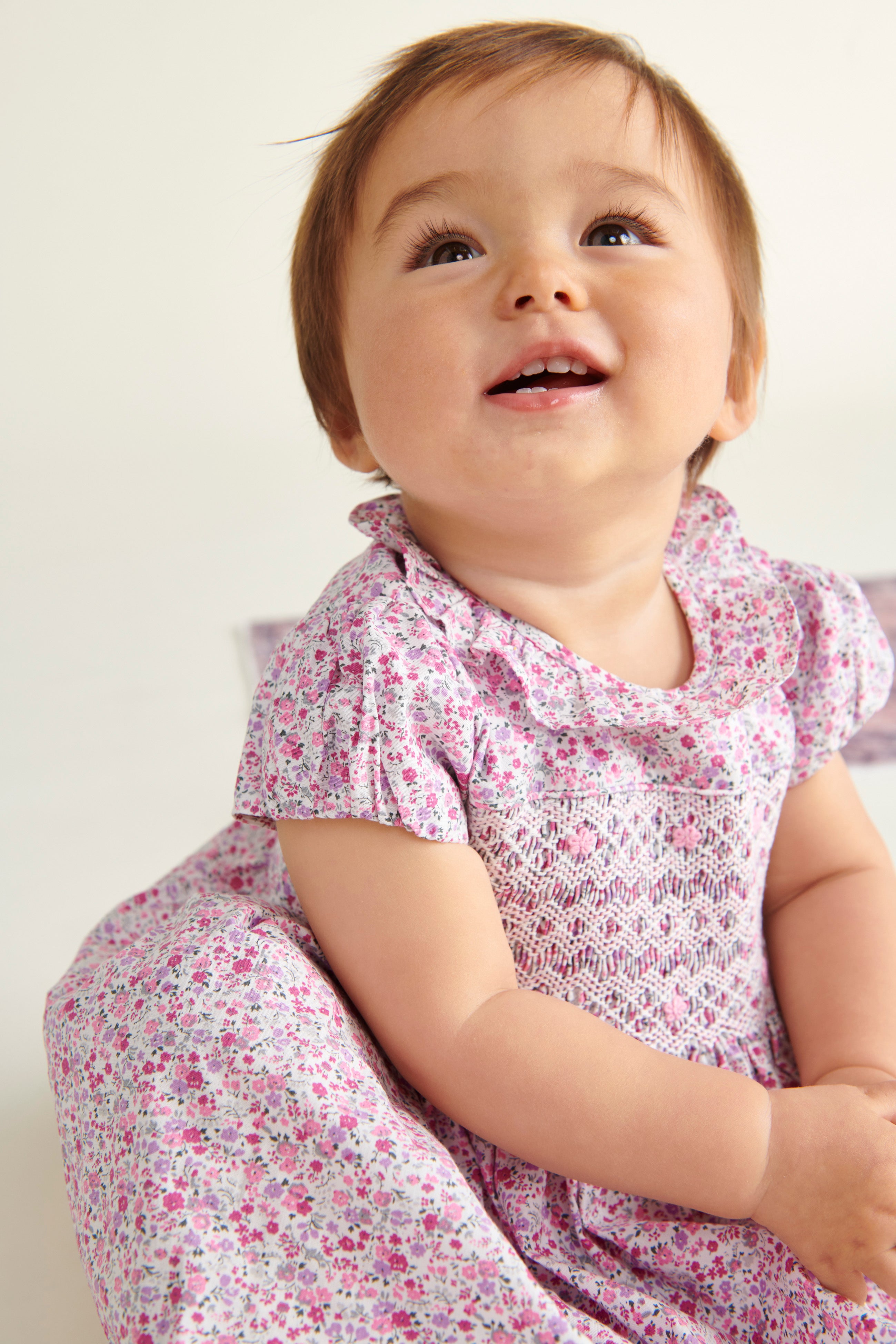 bay in smocked dress, pink floral with frill collar
