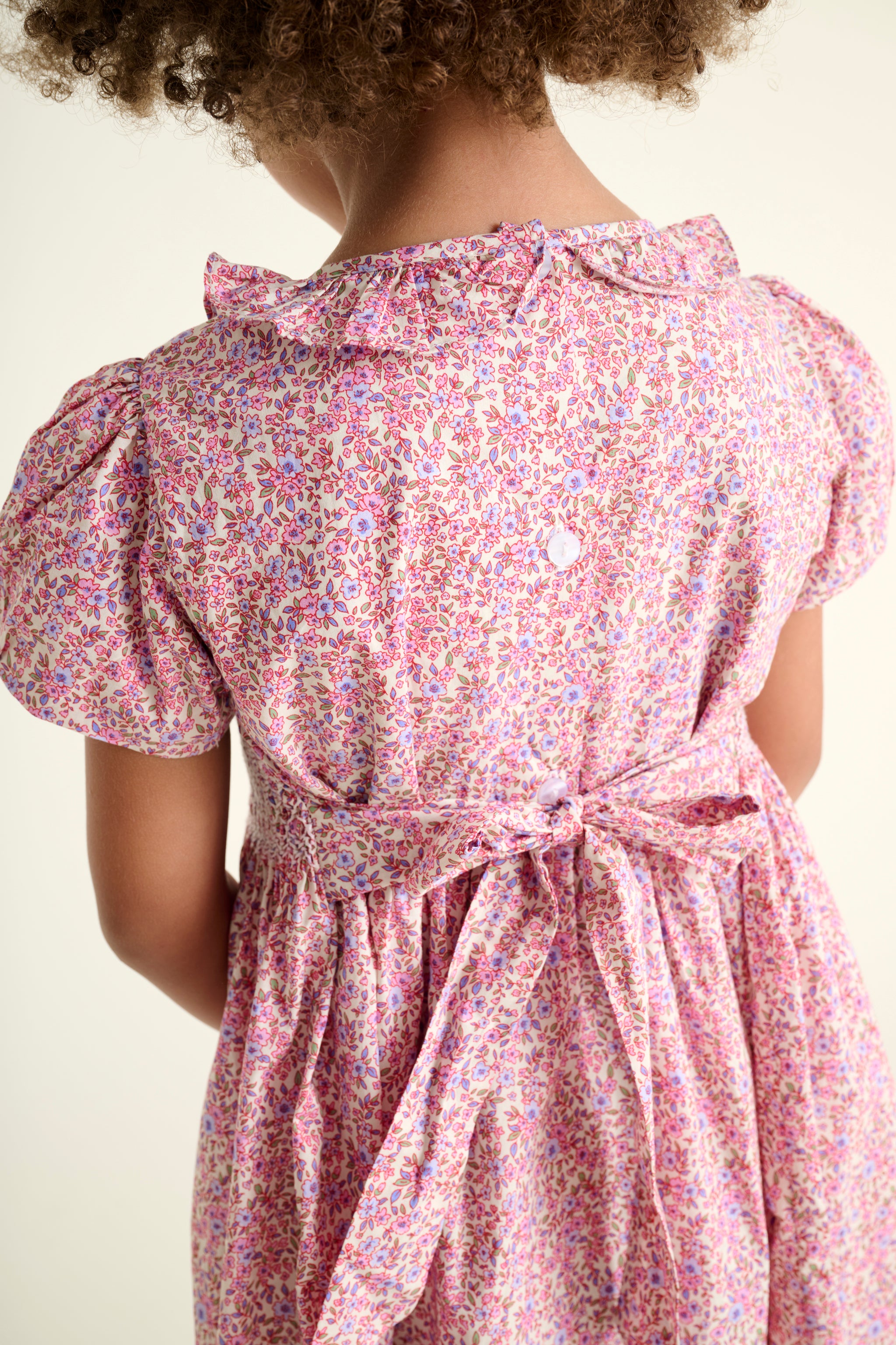 pink floral dress with a bow fastening