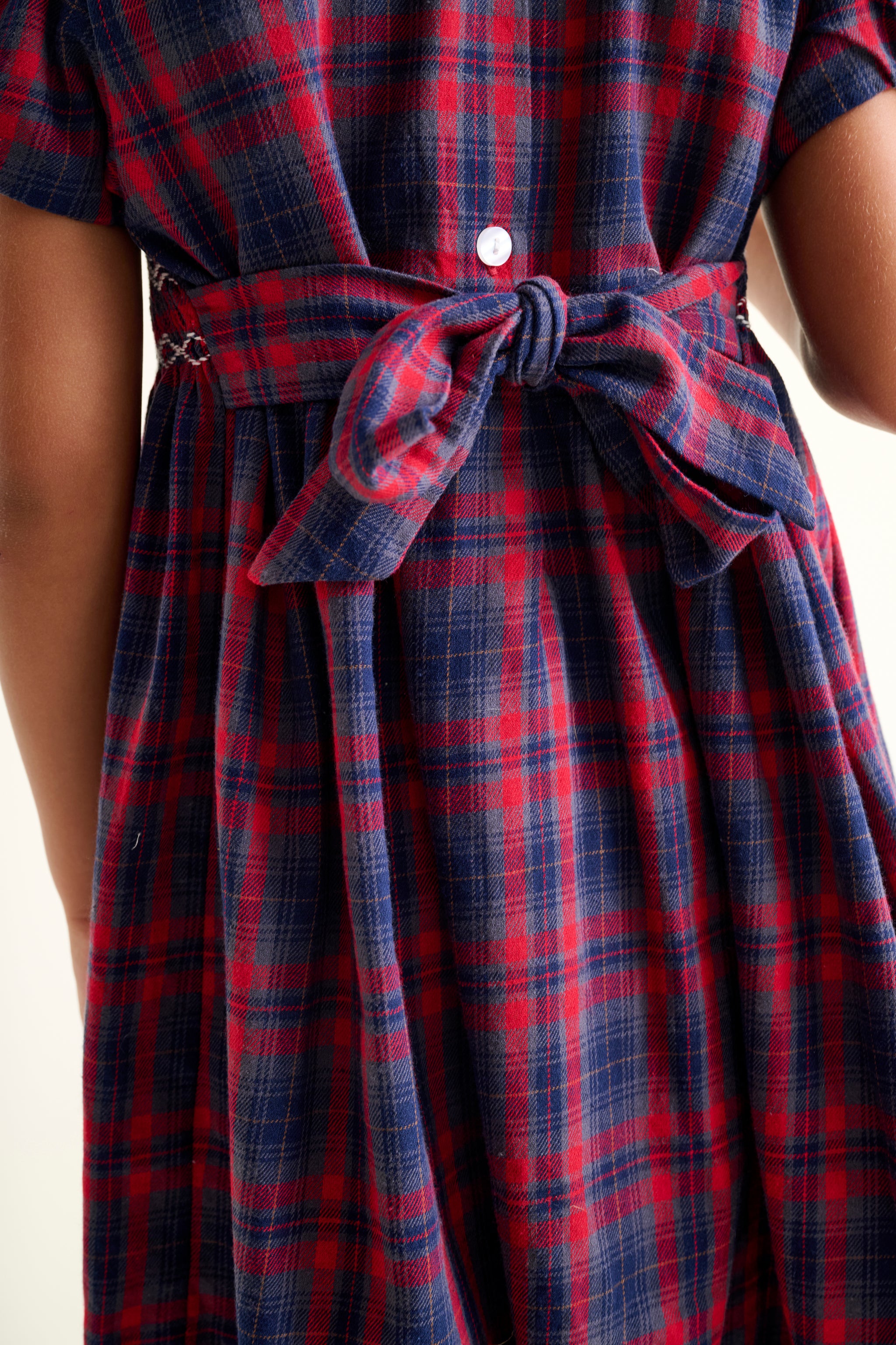 Red and blue plaid dress with a self-tie bow fastening back detail