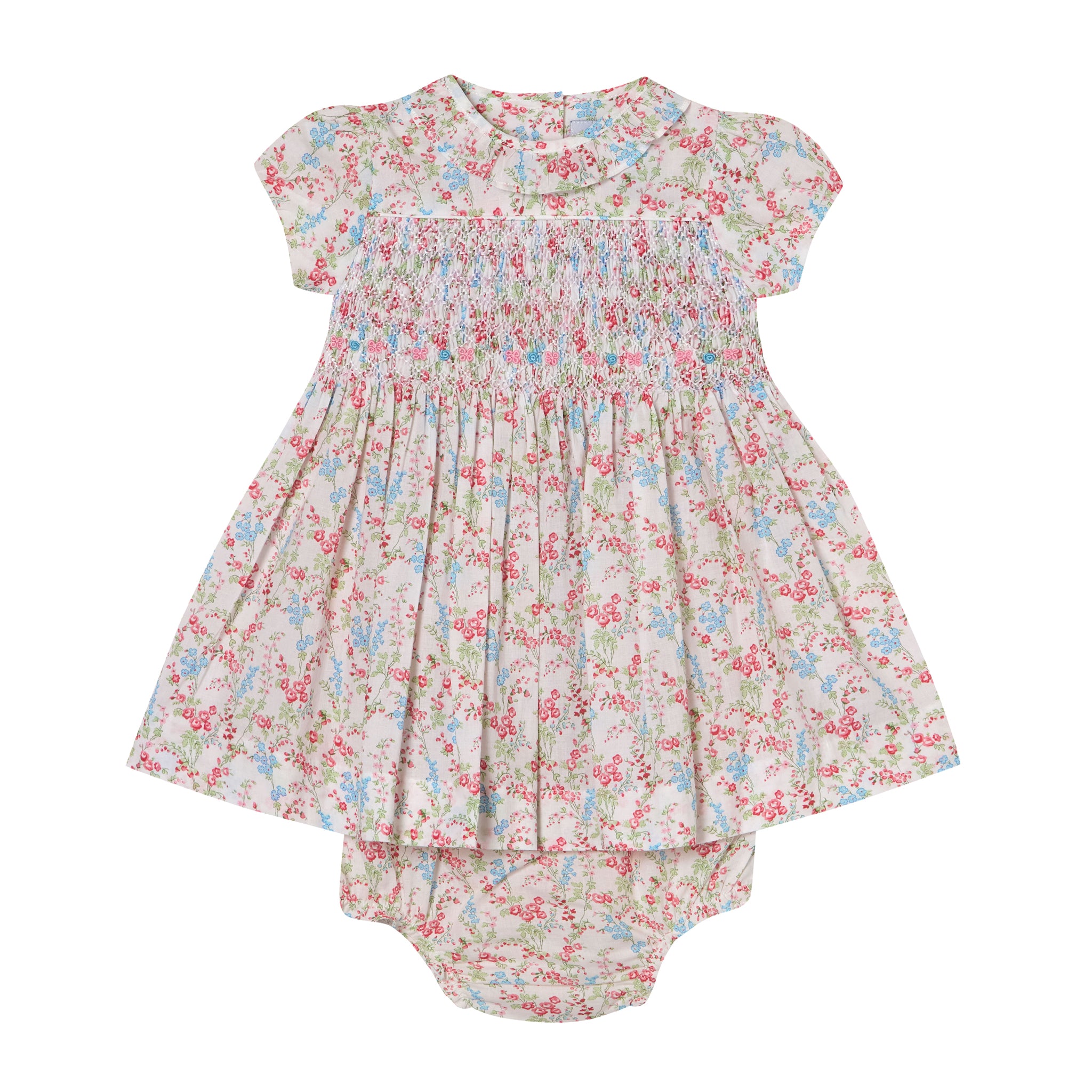 Floral baby dress and bloomers set on a white background