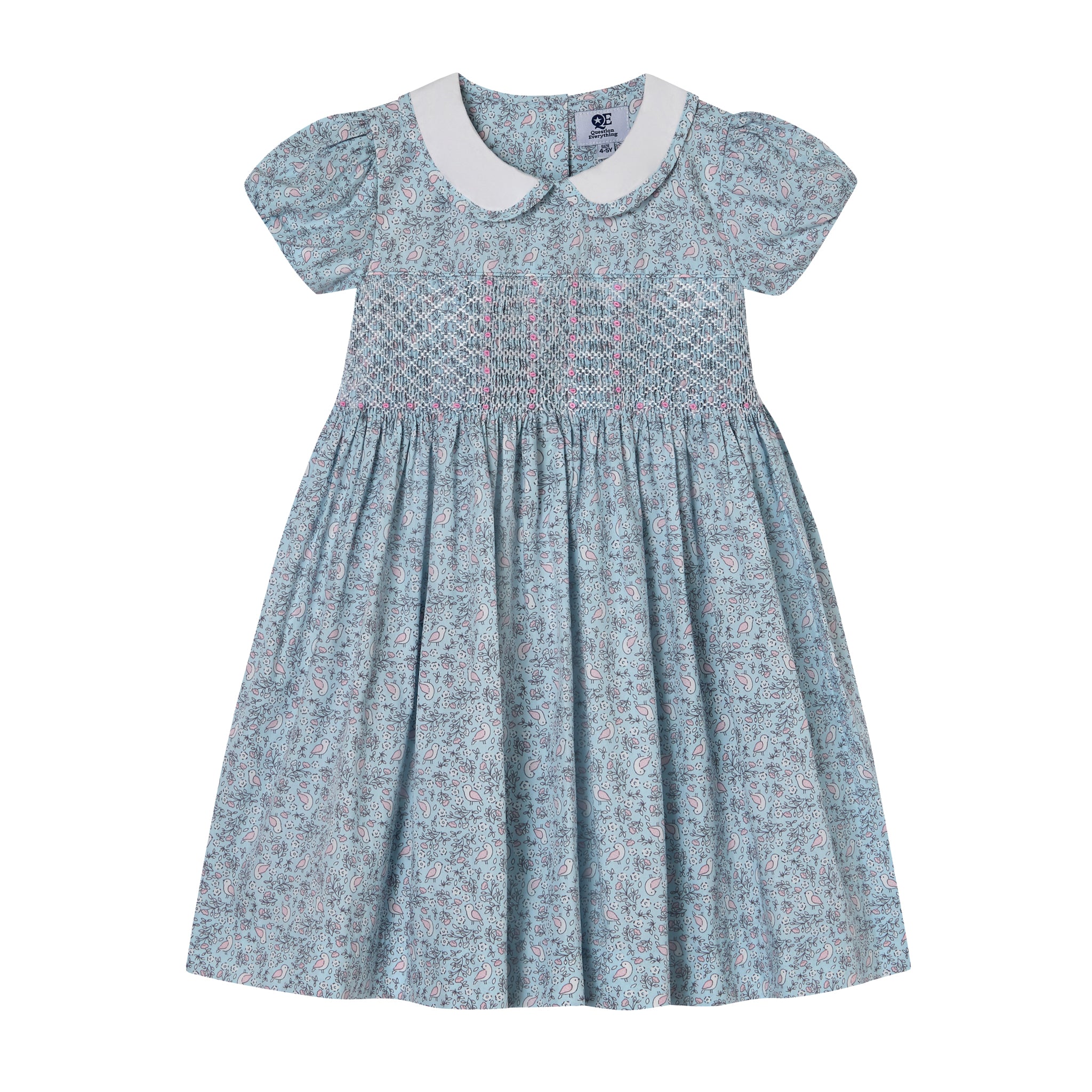 Blue bird pattern dress with white collar on and hand-smocking
