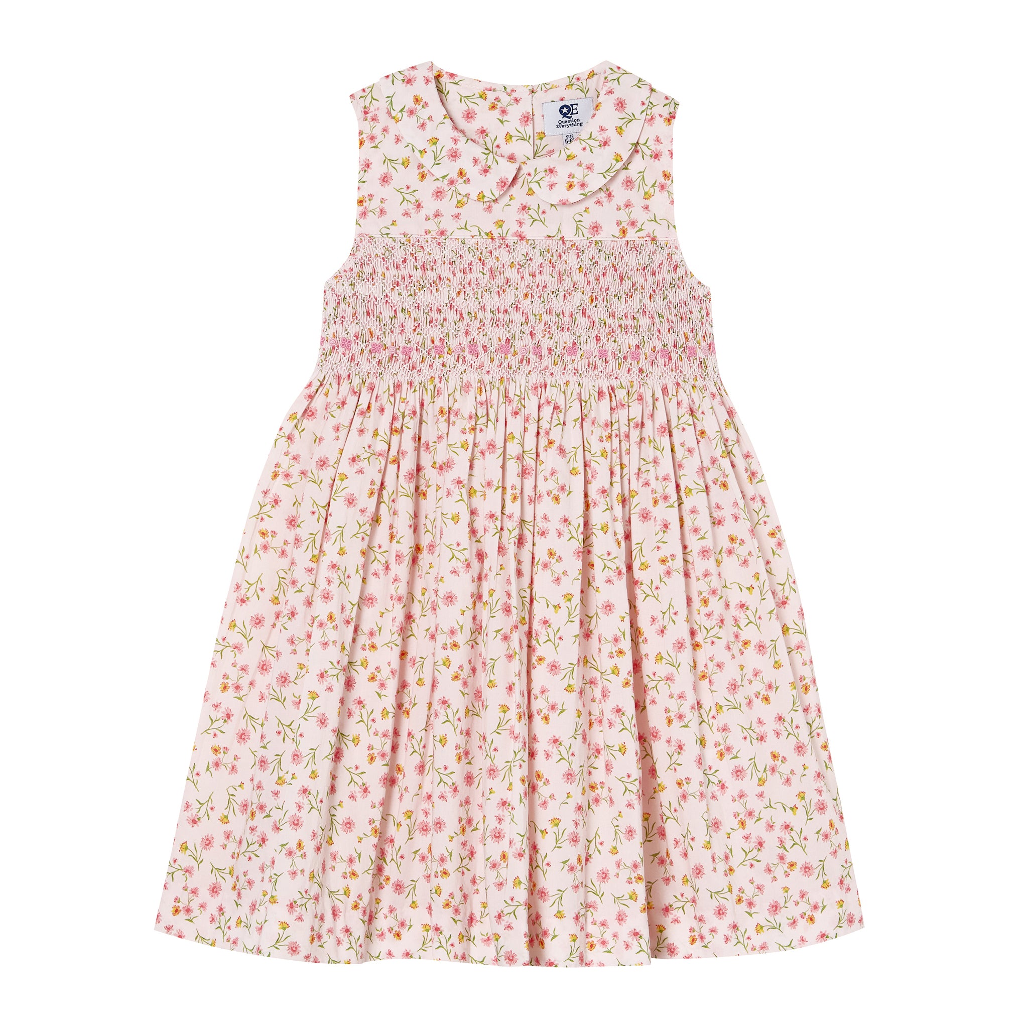Floral hand-smocked dress on a white background