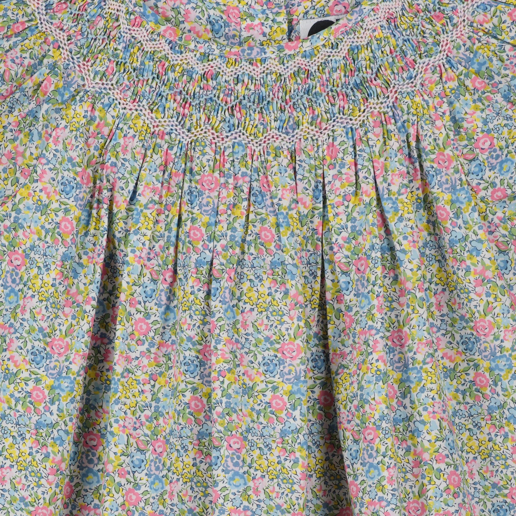 floral girls blouse made from Liberty fabric with smocking, closeup