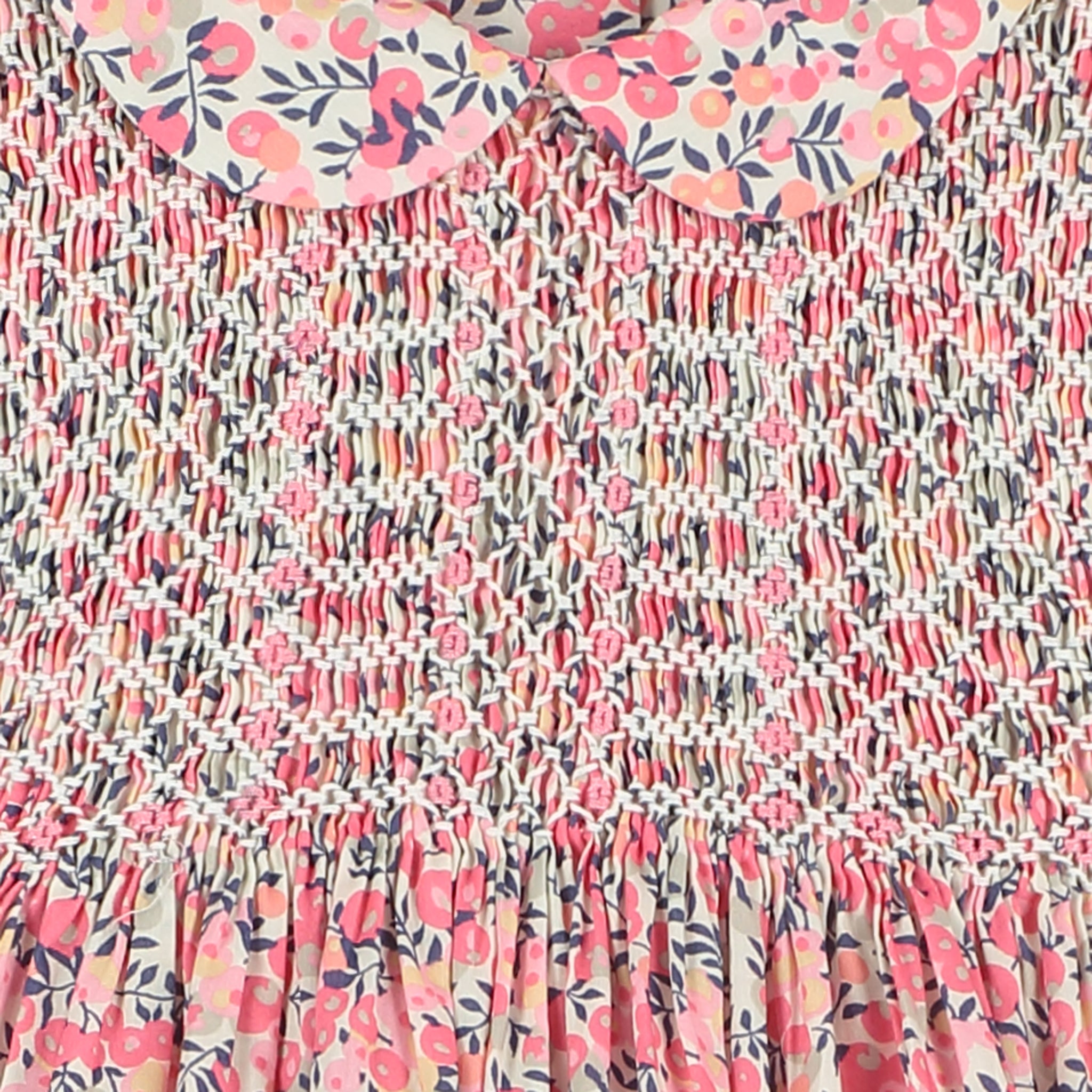 long sleeve Liberty print baby dress, hand-smocked, smocking detail close up