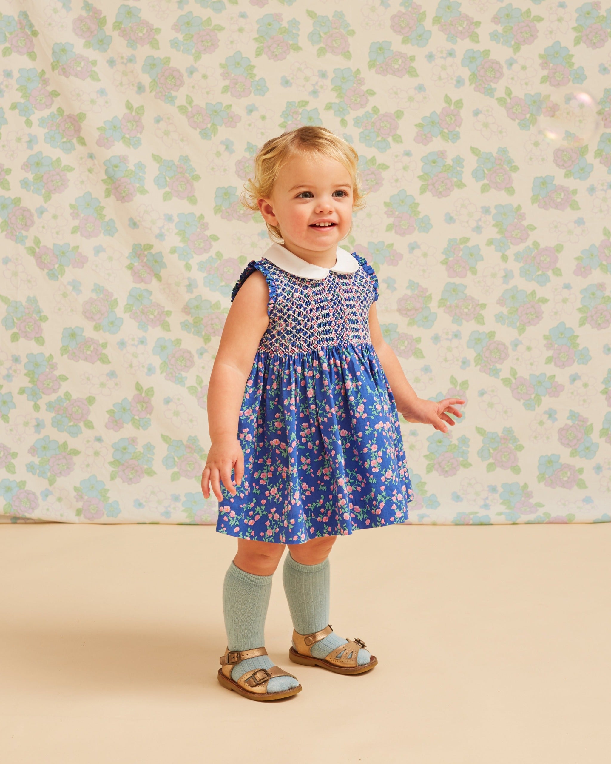 Baby in blue floral summer dress