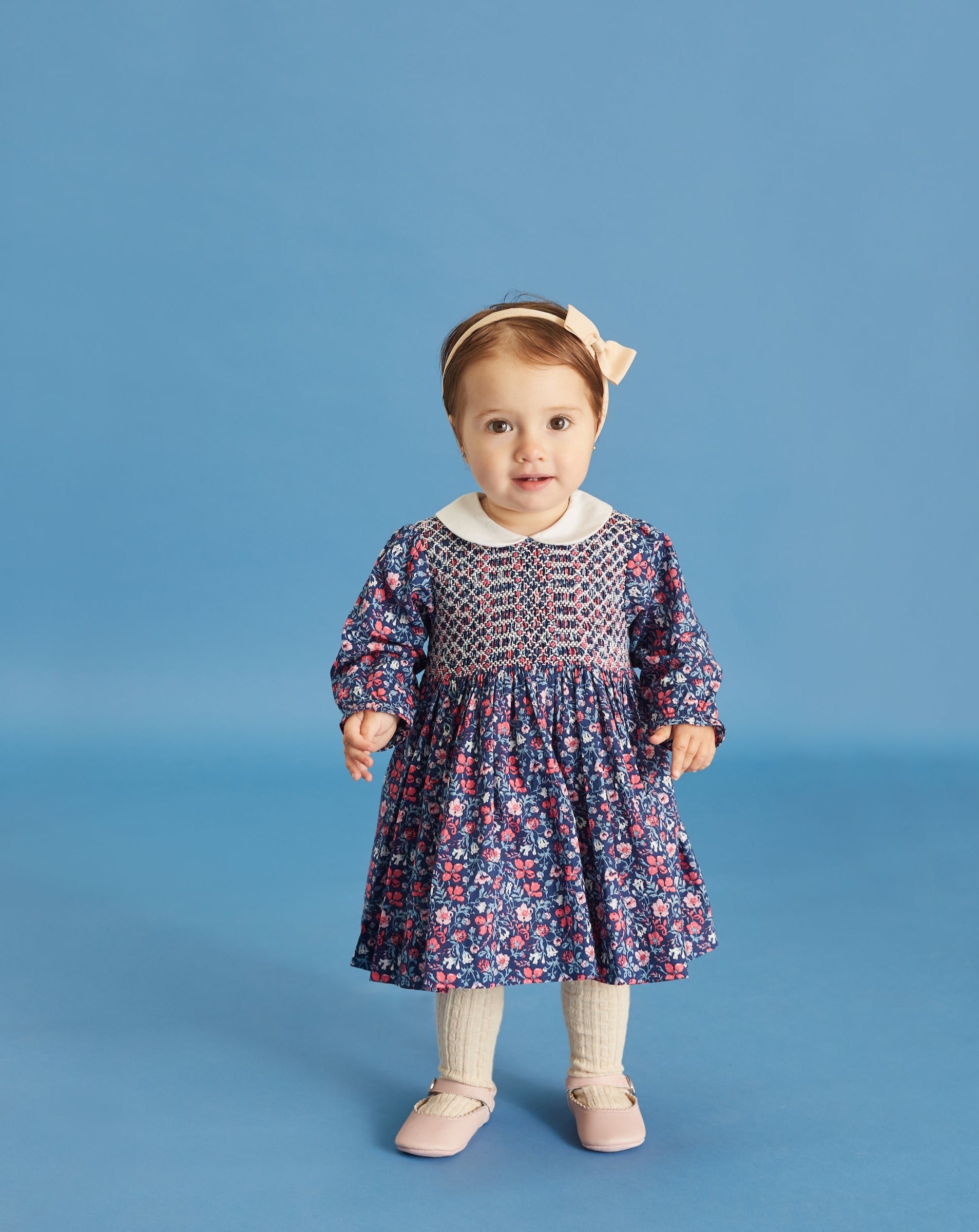 baby girl in hand-smocked dress