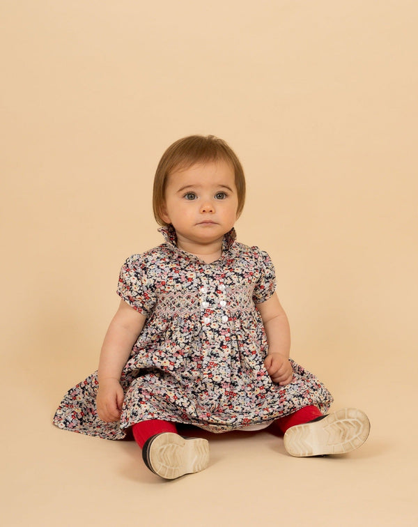 baby in hand-smocked dress