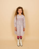 girl in smocked dress and Cowboy boots