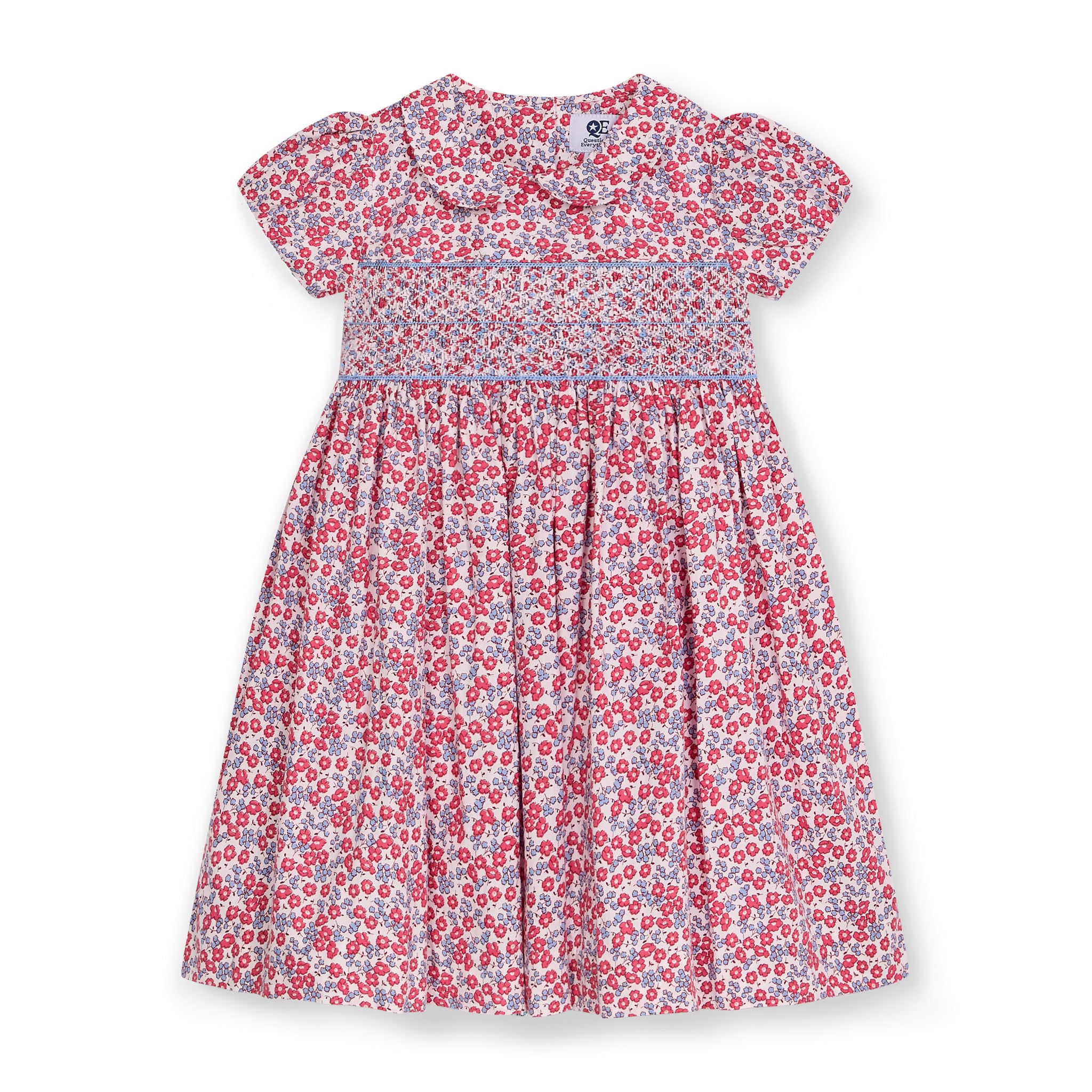 Floral dress with red and blue two-tone smocking on a white background