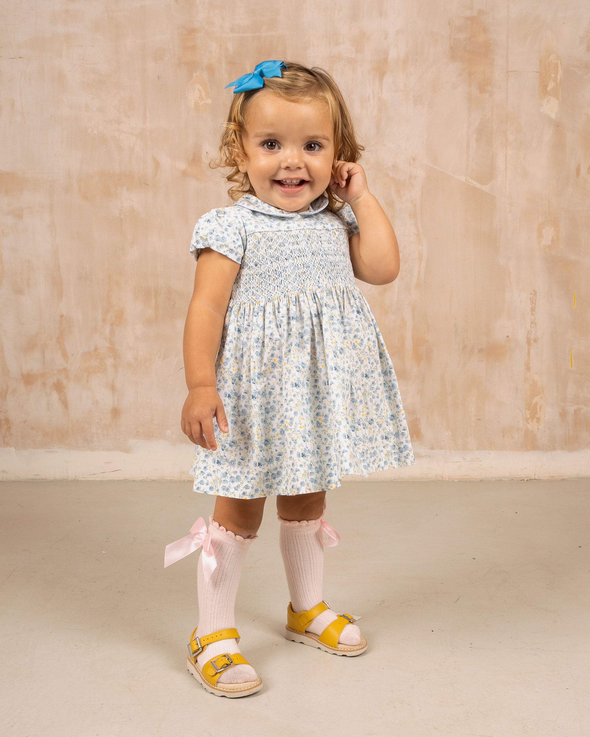 White floral baby dress with smocking