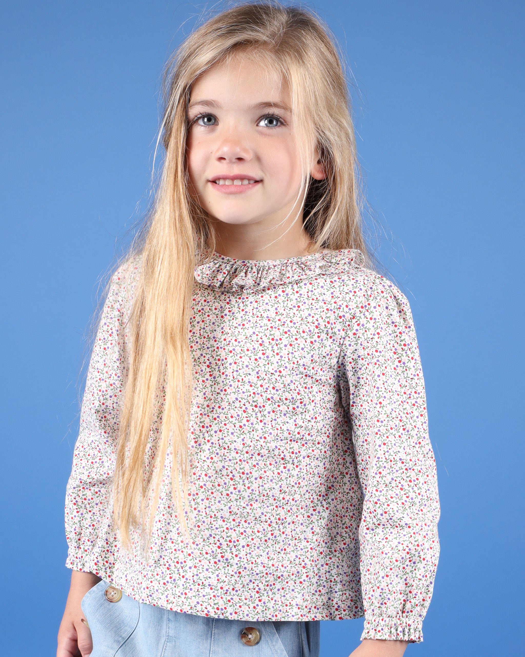 girl in floral long sleeve blouse