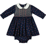 hand-smocked baby dress made from cherry print fabric