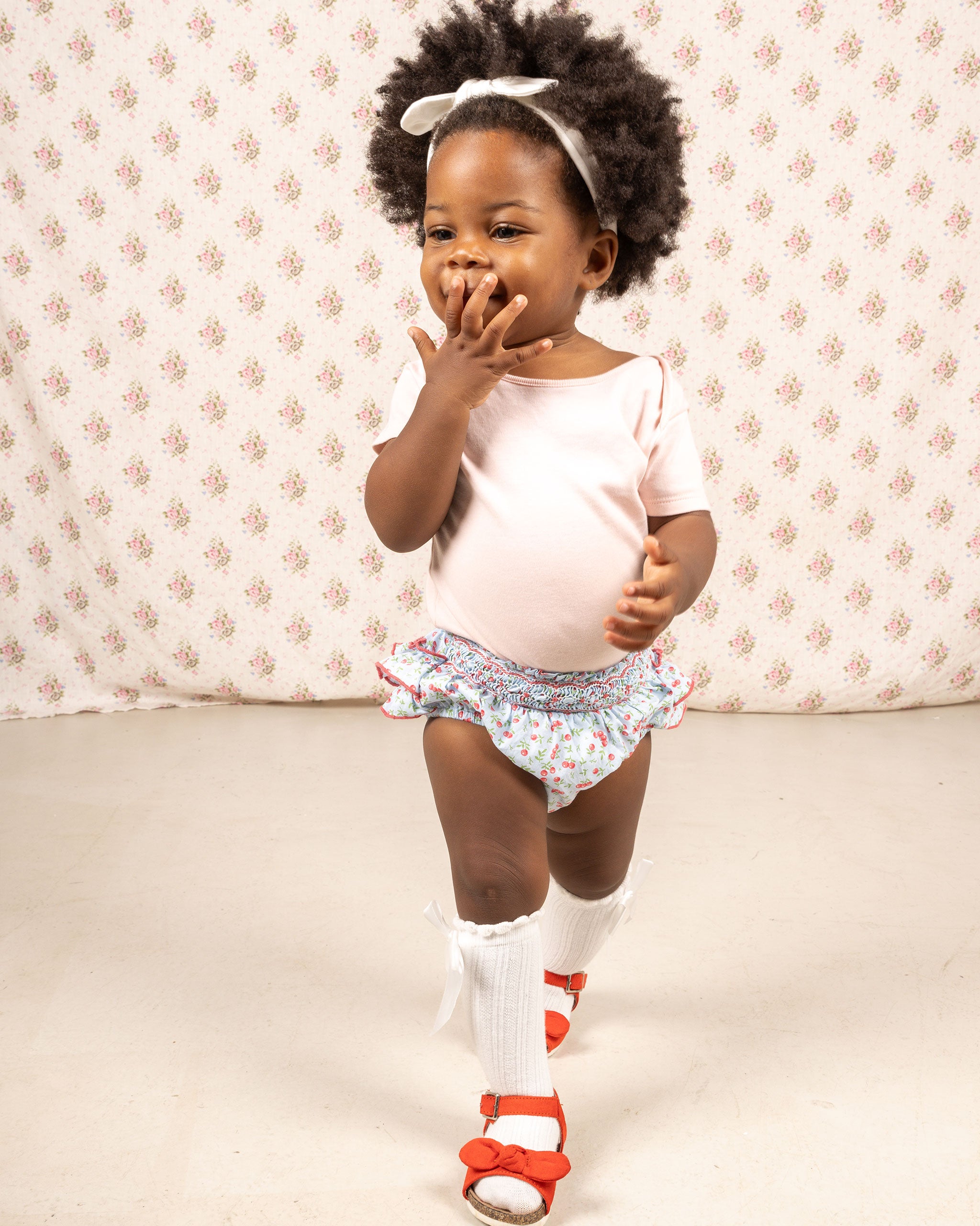 toddler in shorts, smocked, blue, cherry print