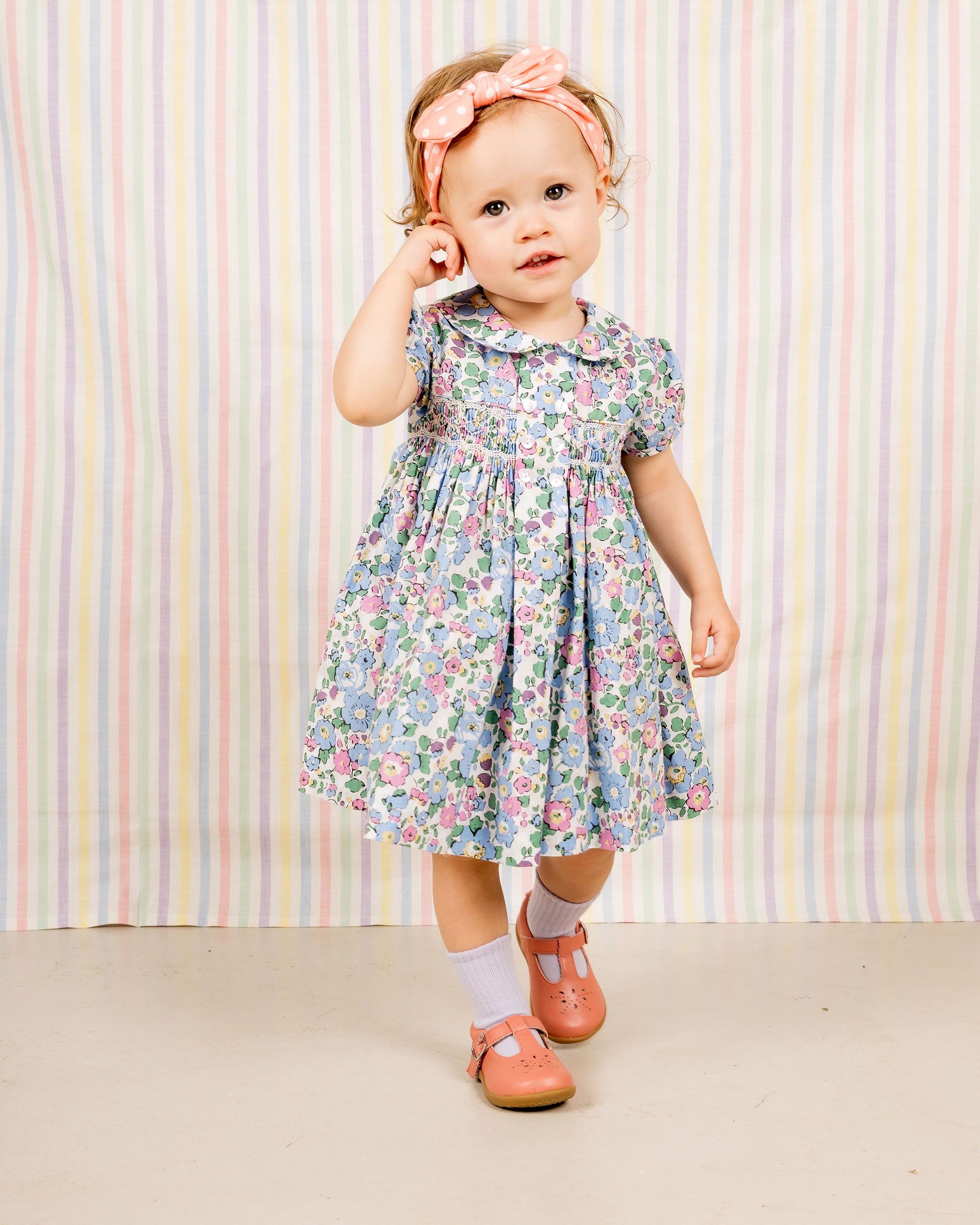 cute toddler in adorable floral smockdress, 