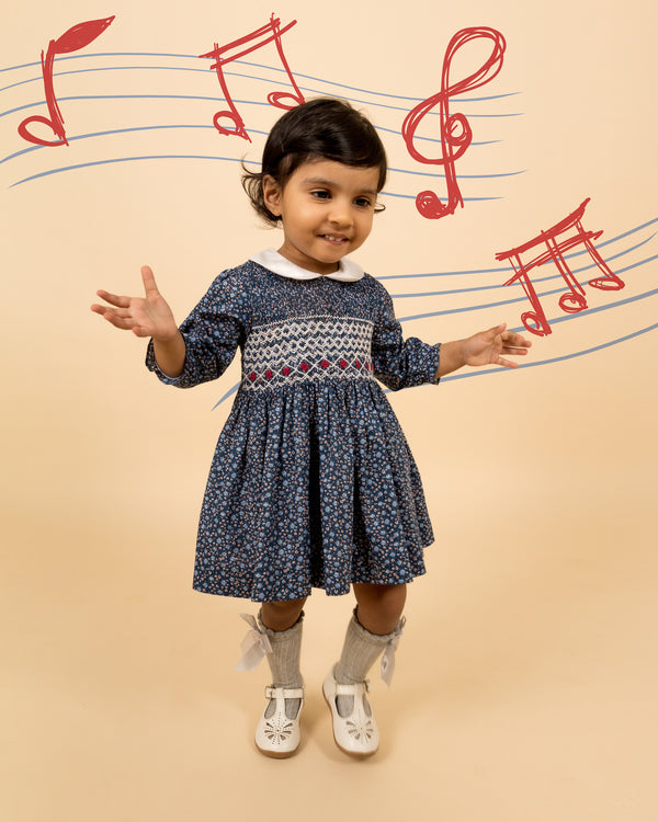 girl in smocked dress, musical note background