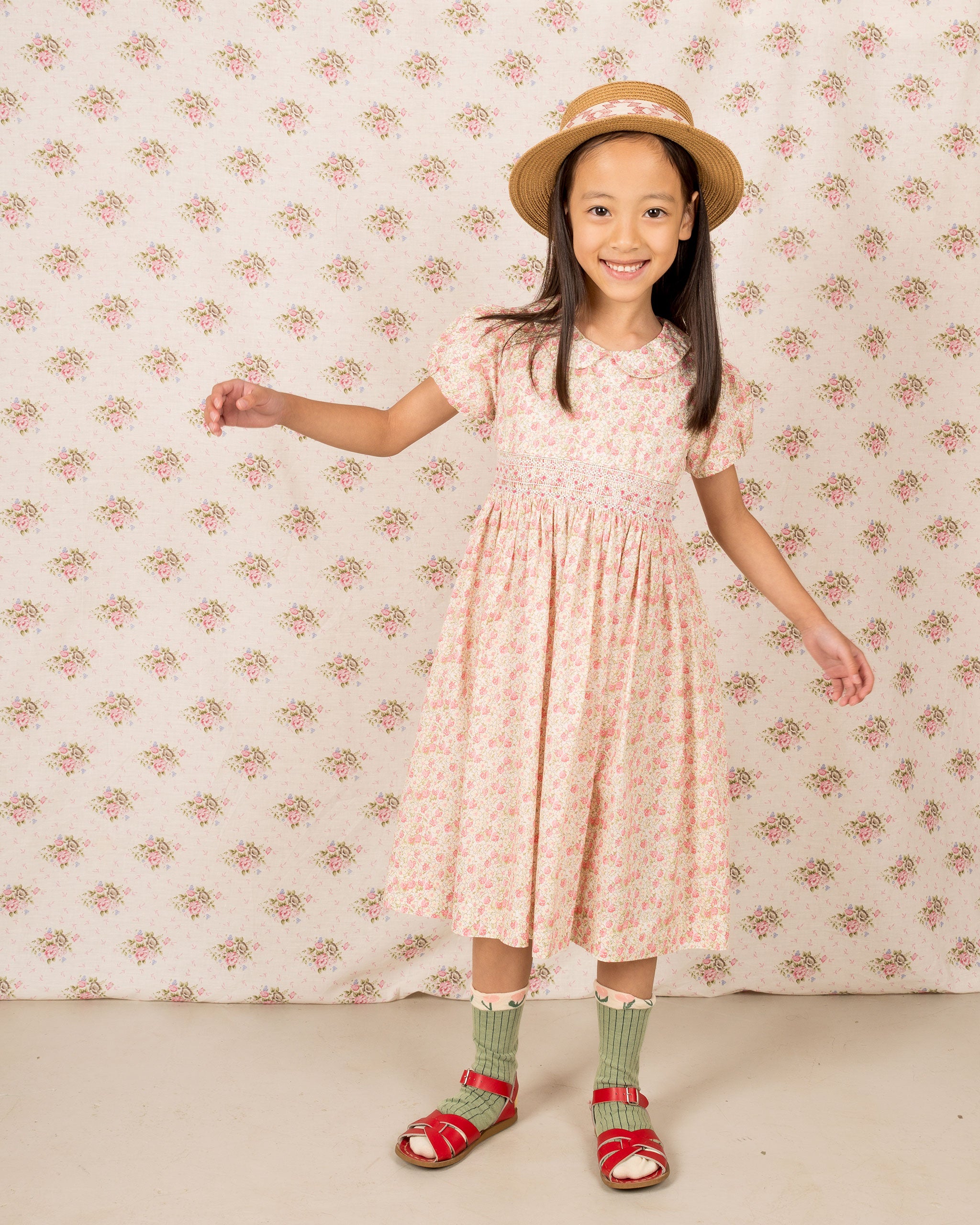 girl in strawberry print dress with smocking