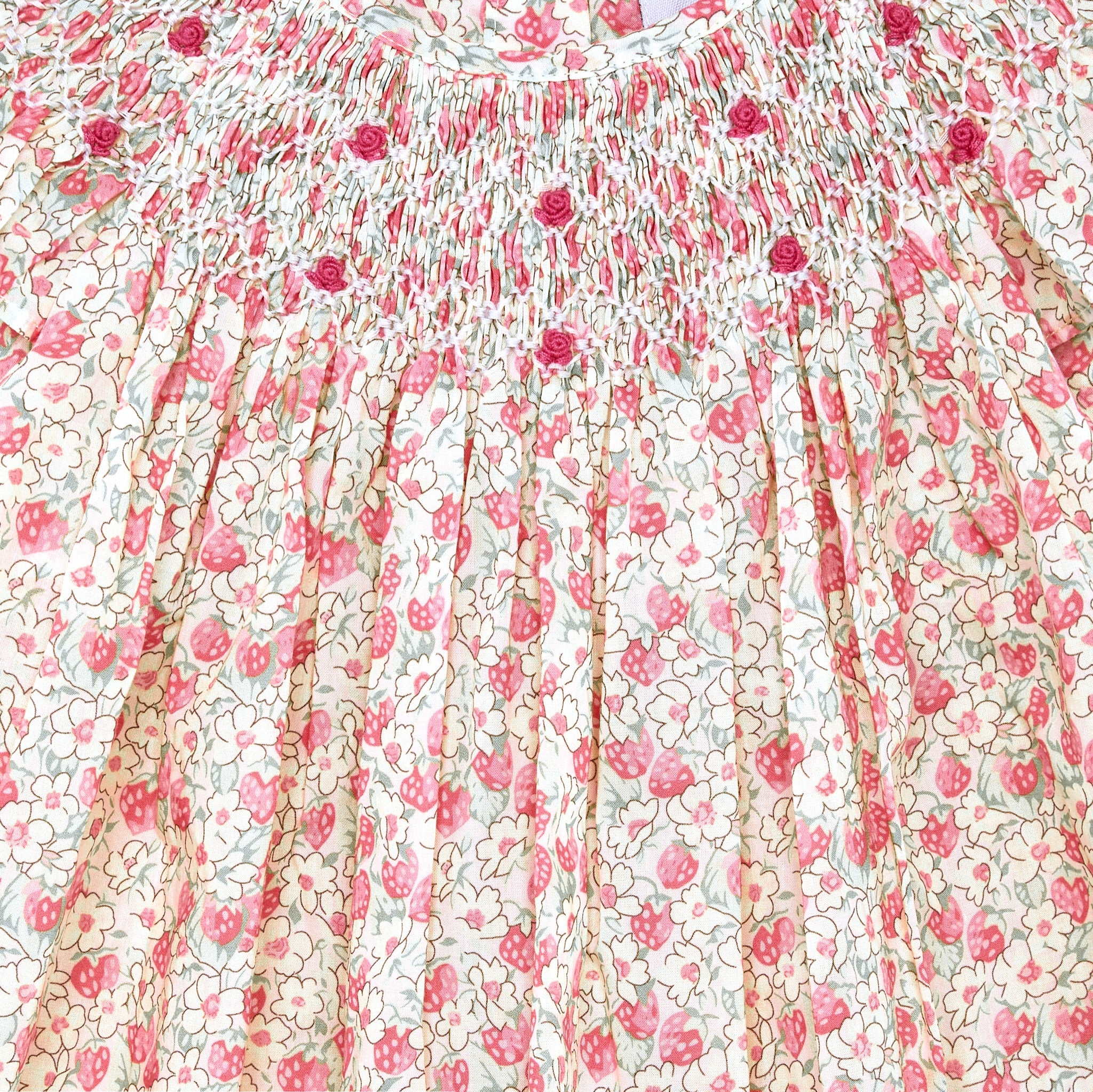 strawberry blossom hand-smocked dress, pastel coloured, closeup