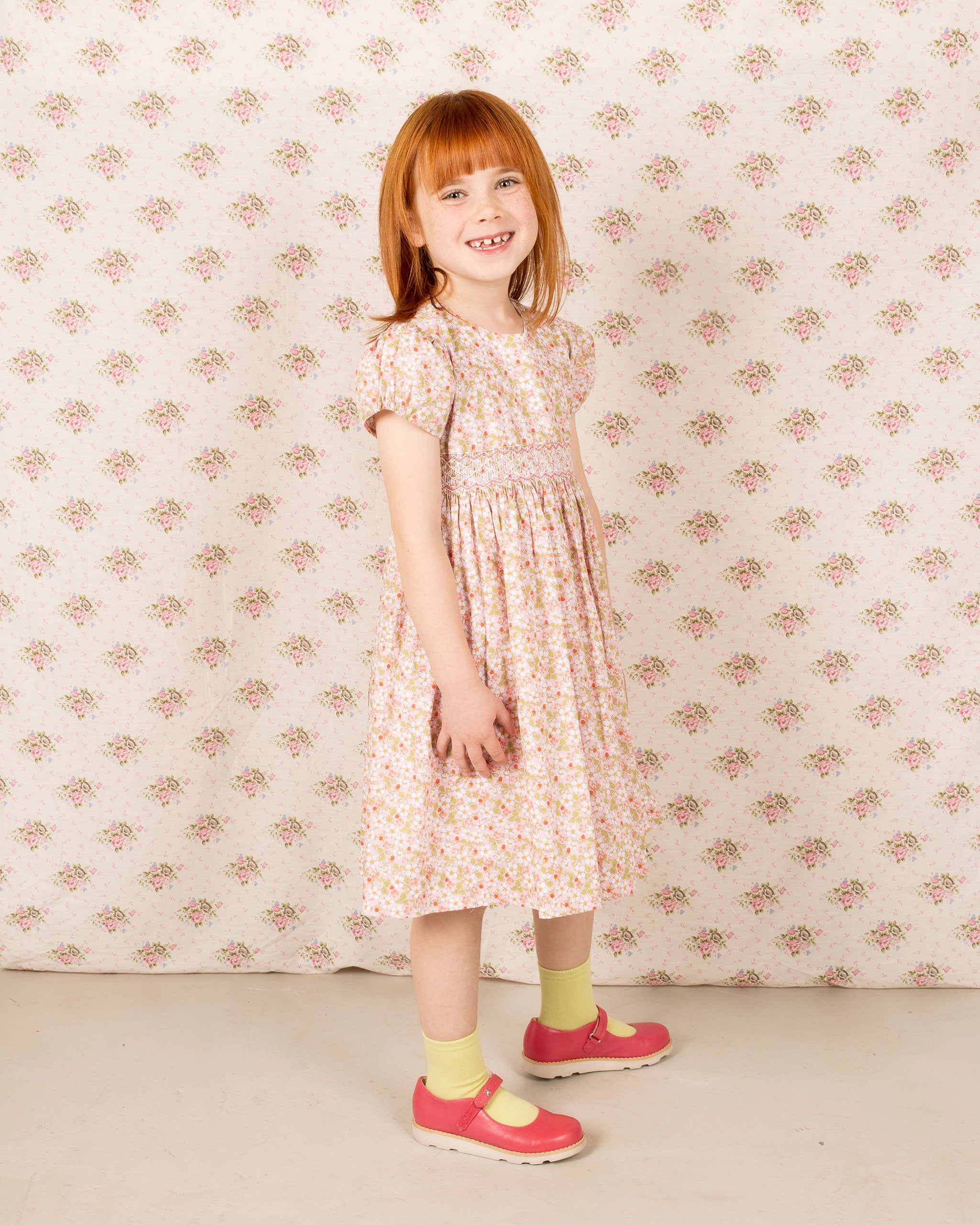 girl in Liberty fabric smock dress